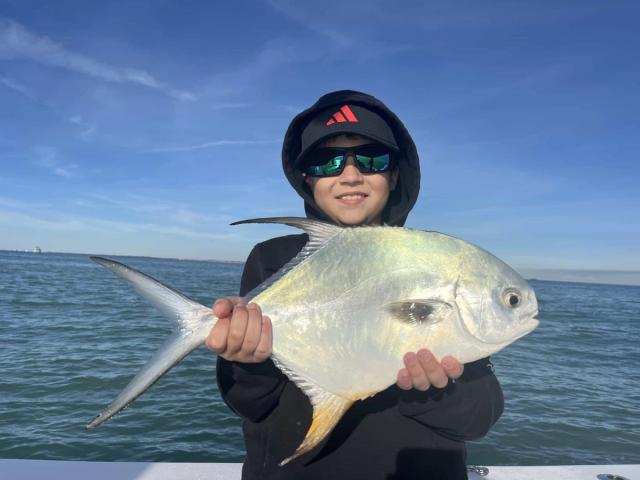 Captain David White Fishing Charters client with their catch