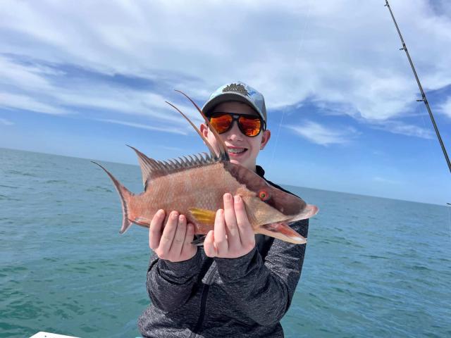 Captain David White Fishing Charters client with their catch