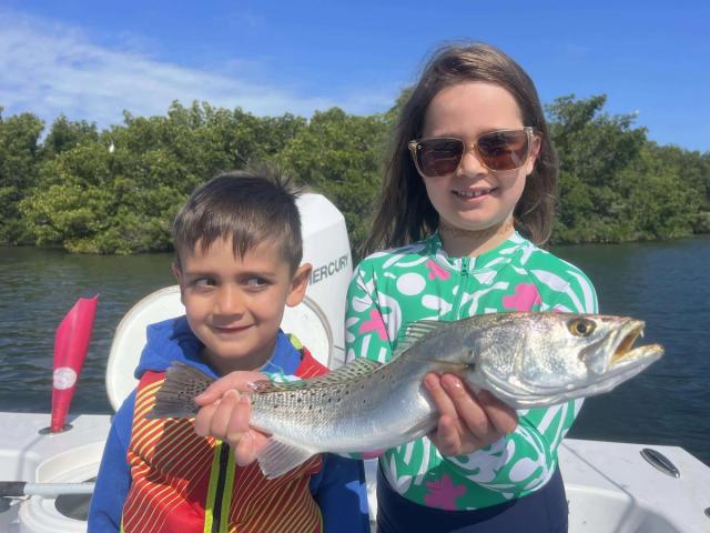 Captain David White Fishing Charters client with their catch