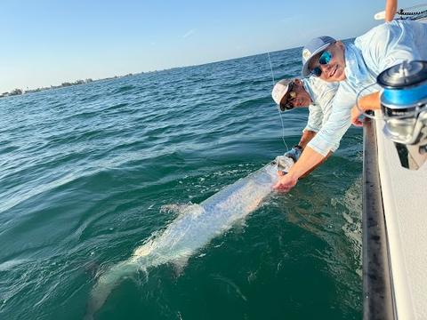 Captain Dave and client releasing large tarpon