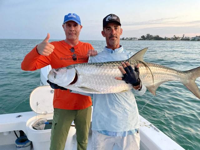 Captain David White Fishing Charters client with their catch