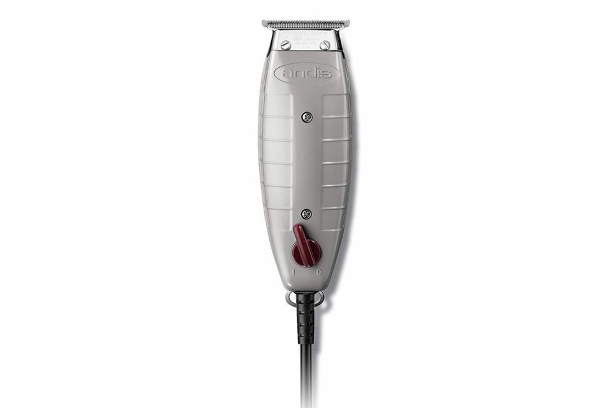 Silver Andis hair clipper with cord.