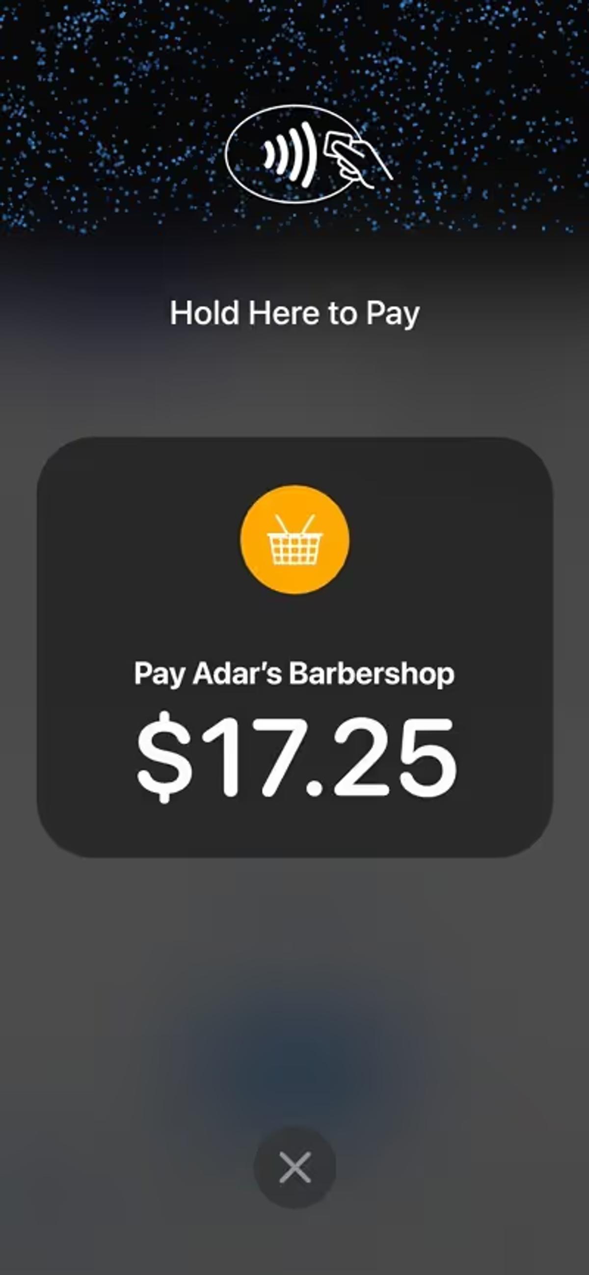 Illustration of a smartphone using tap to pay feature at a barbershop.