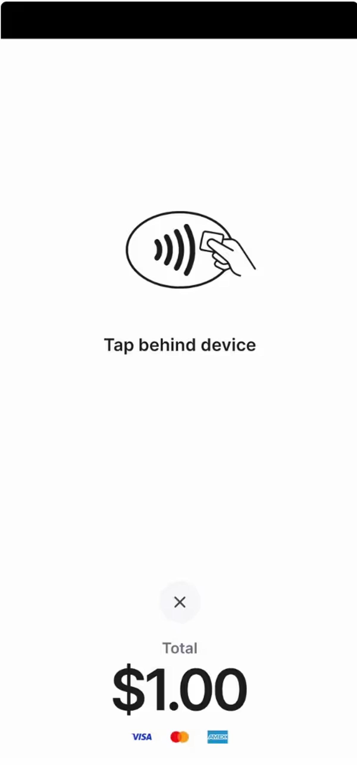 Customer using mobile device for tap-to-pay at a barbershop checkout.
