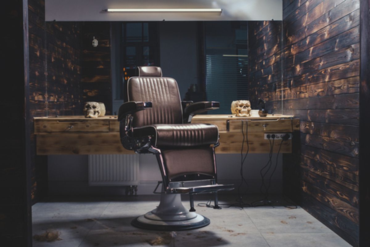 Barber chair in a dimly lit salon.