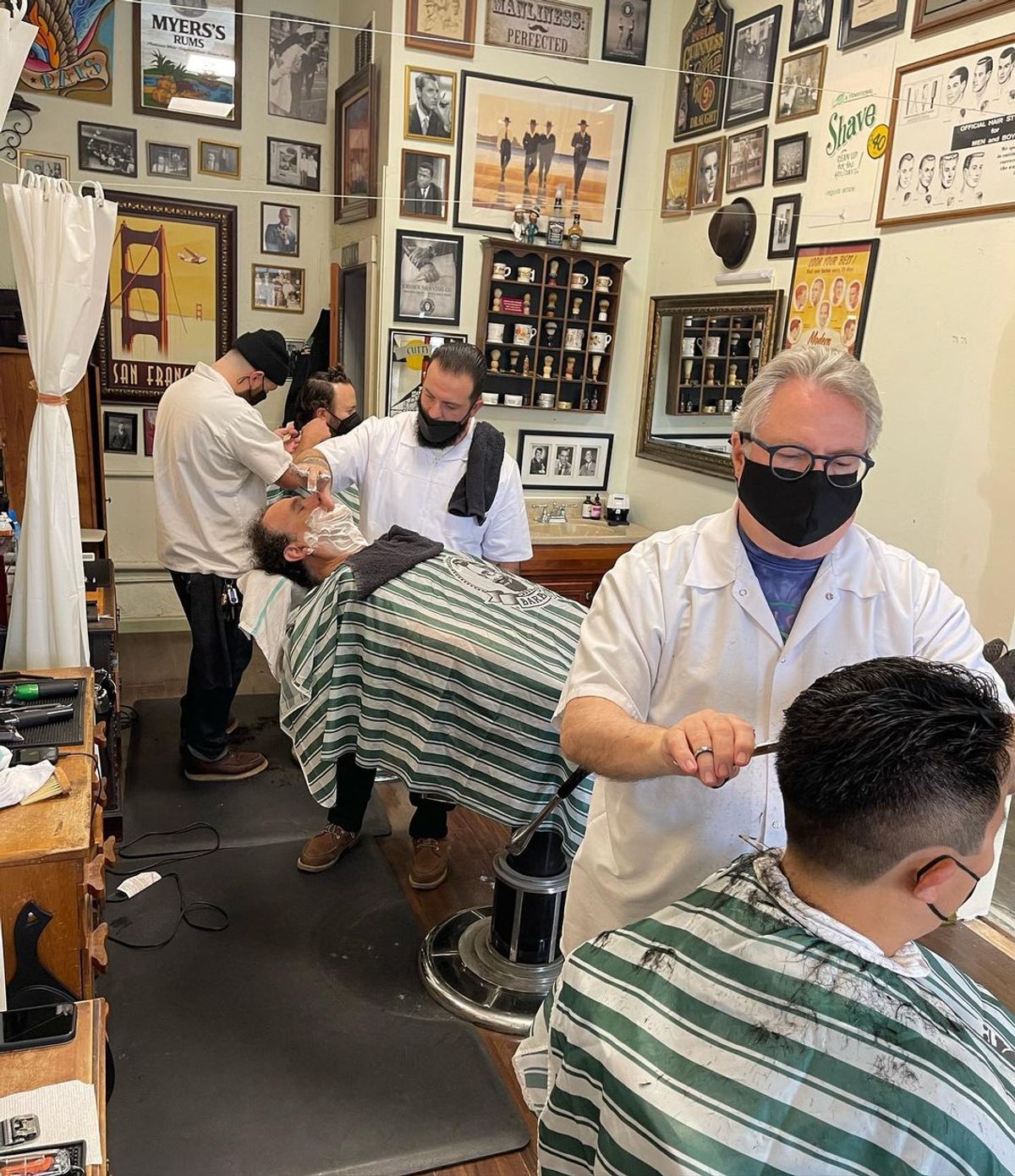 Barbers at work at Mark-Jason Solofa Men's Grooming