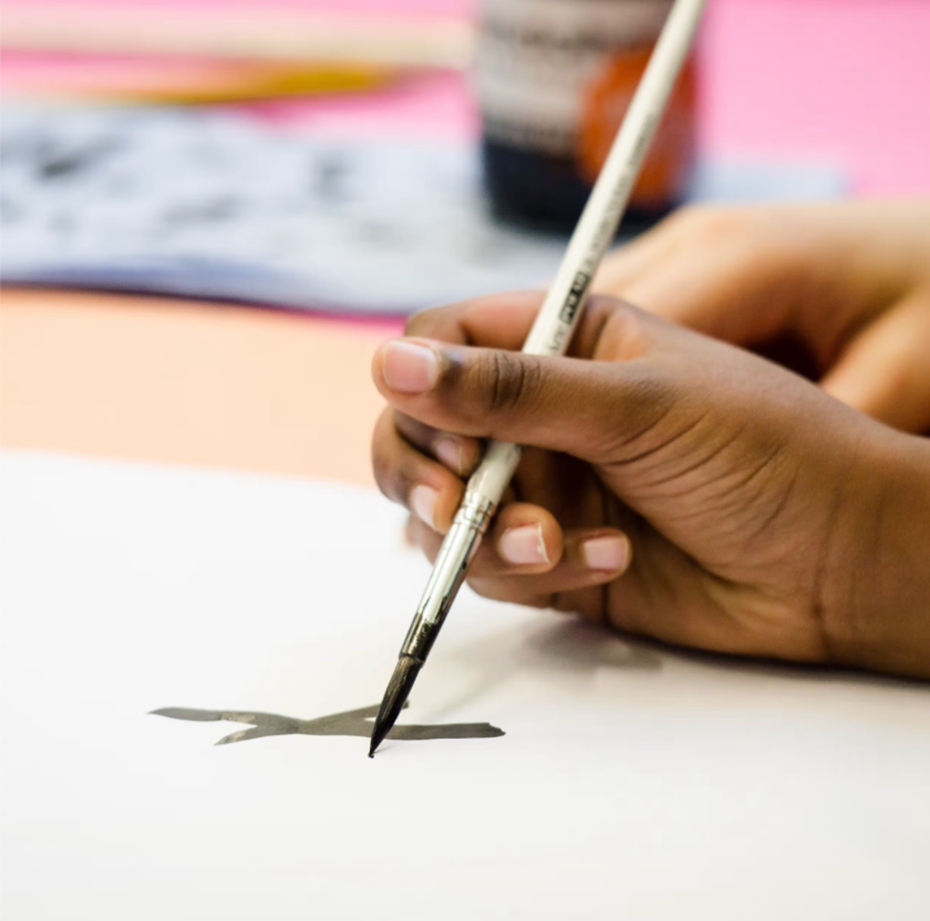 Close up or a brush and ink mark making on paper