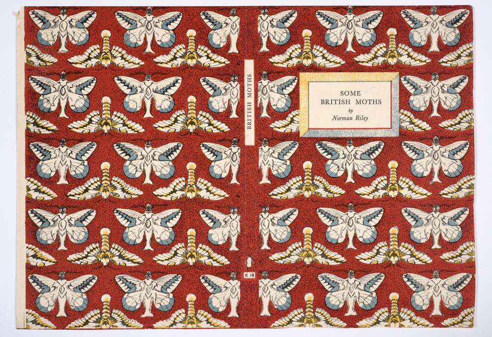 A deep red book cover with a repeated moth print