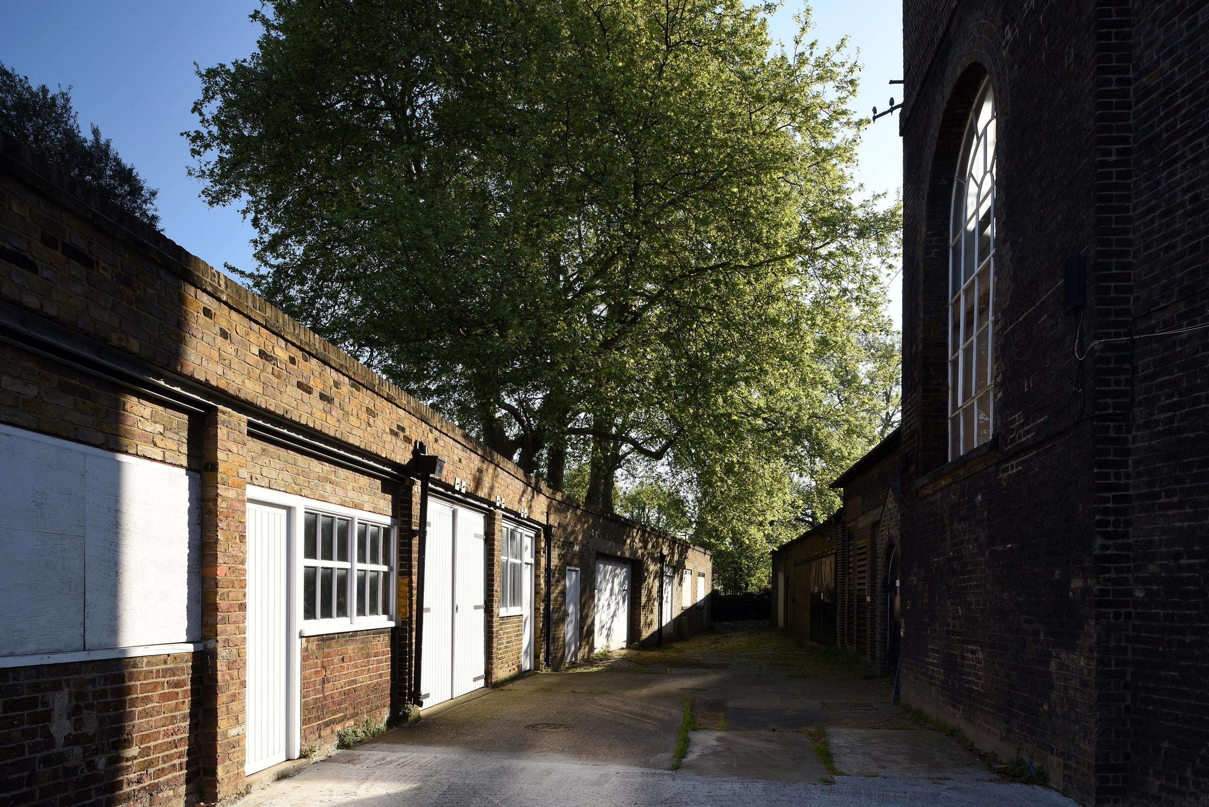 Path between industrial brick buildings