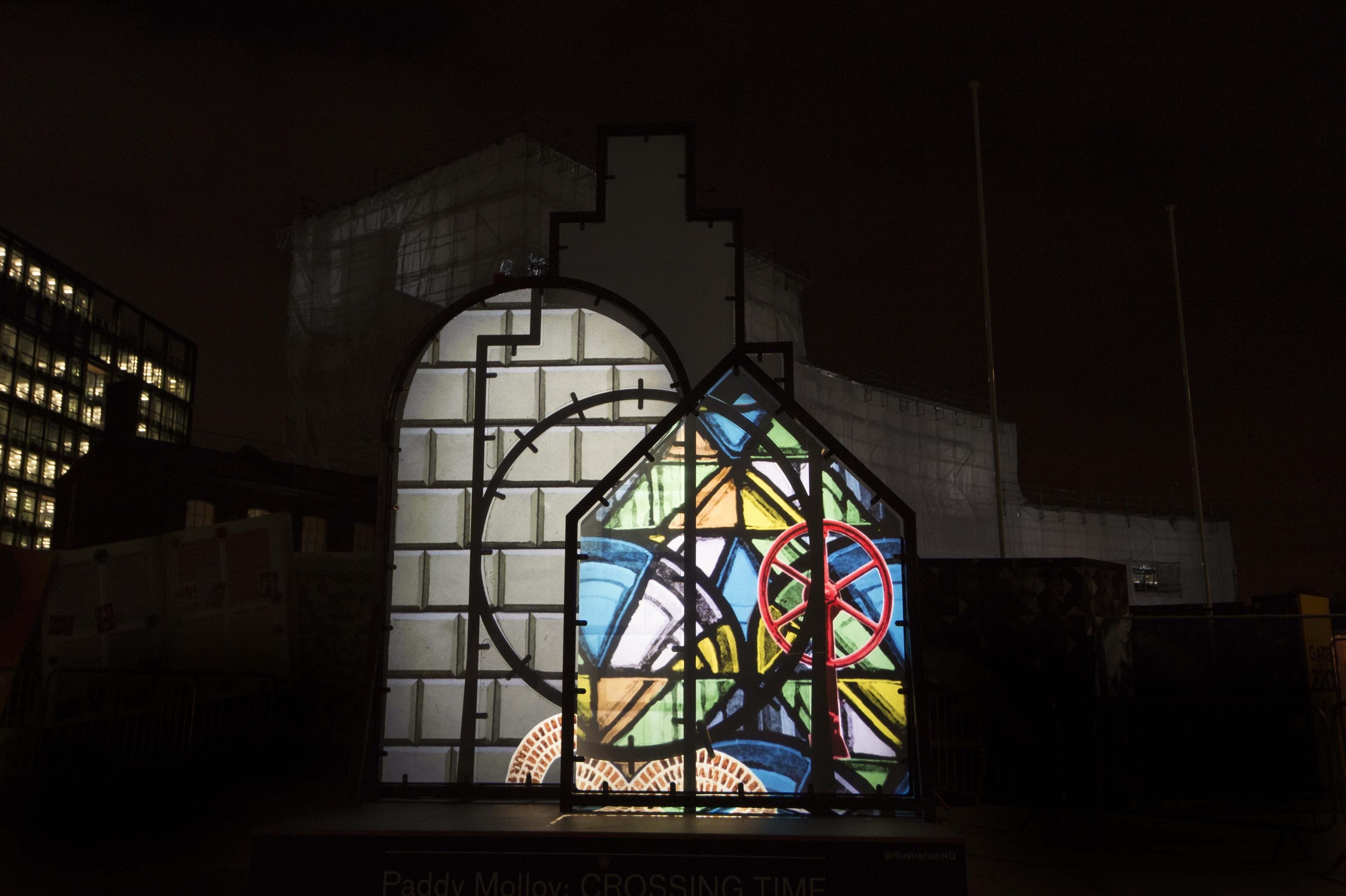 Art installation. Shapes installed outside with illustrations projected onto the shapes.