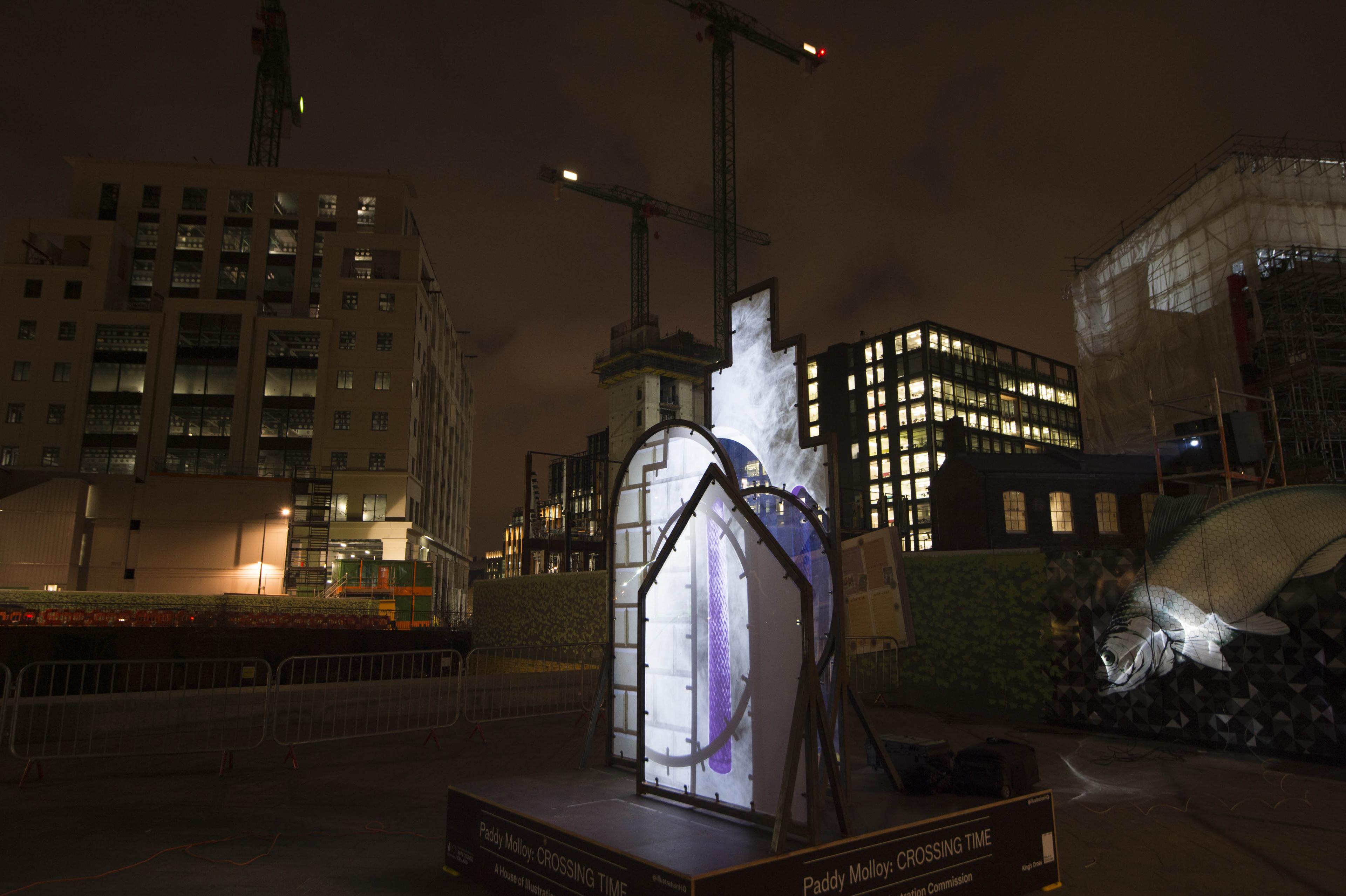 Art installation. Shapes installed outside with illustrations projected onto the shapes.