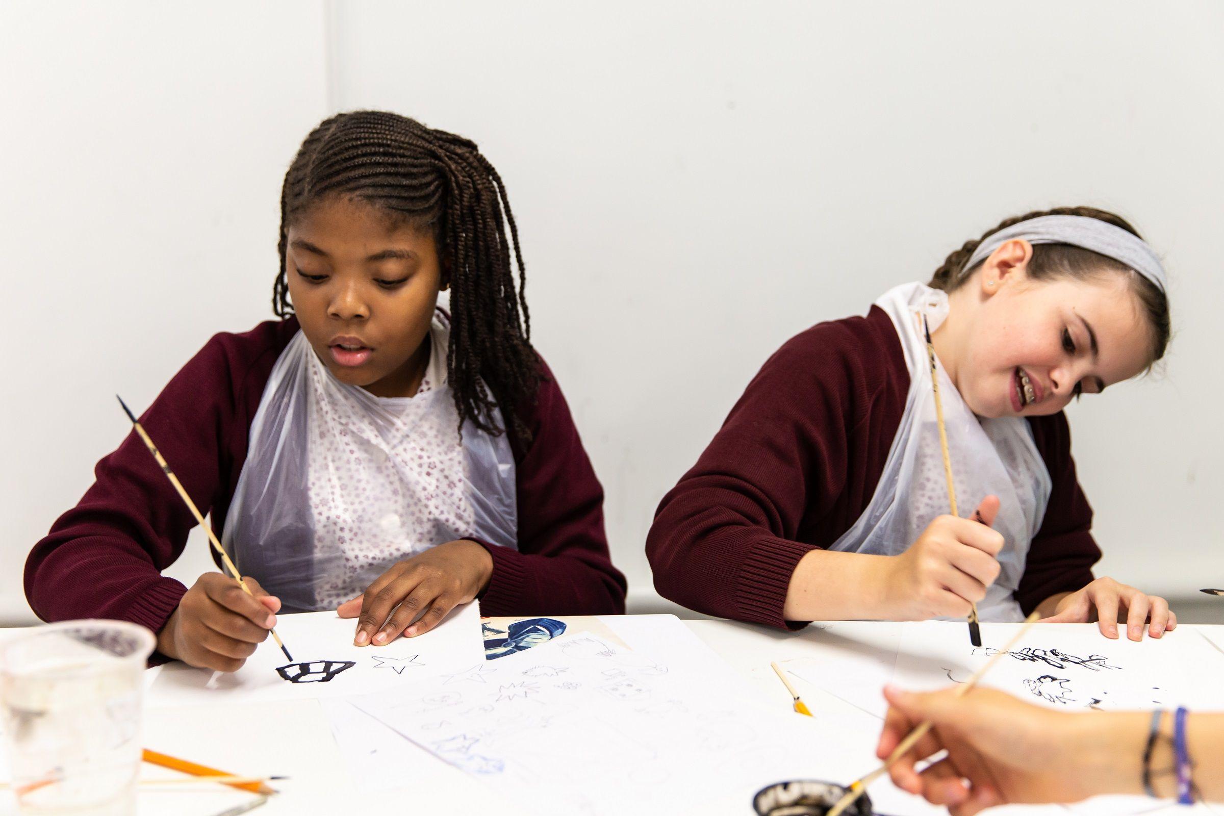 Two school pupils drawing