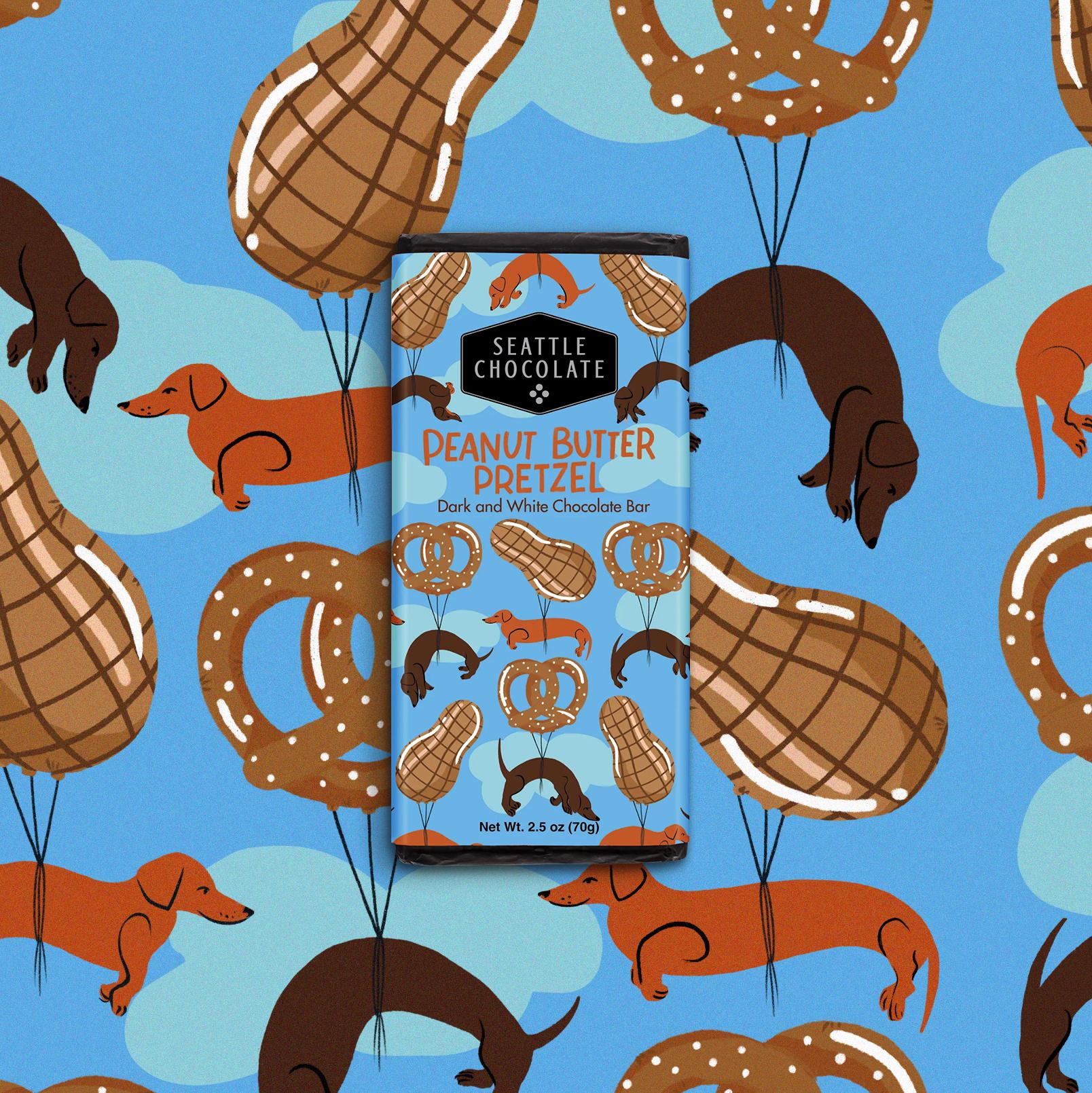 A chocolate bar sits on a background. Both have a fun pattern of dogs and pretzels.