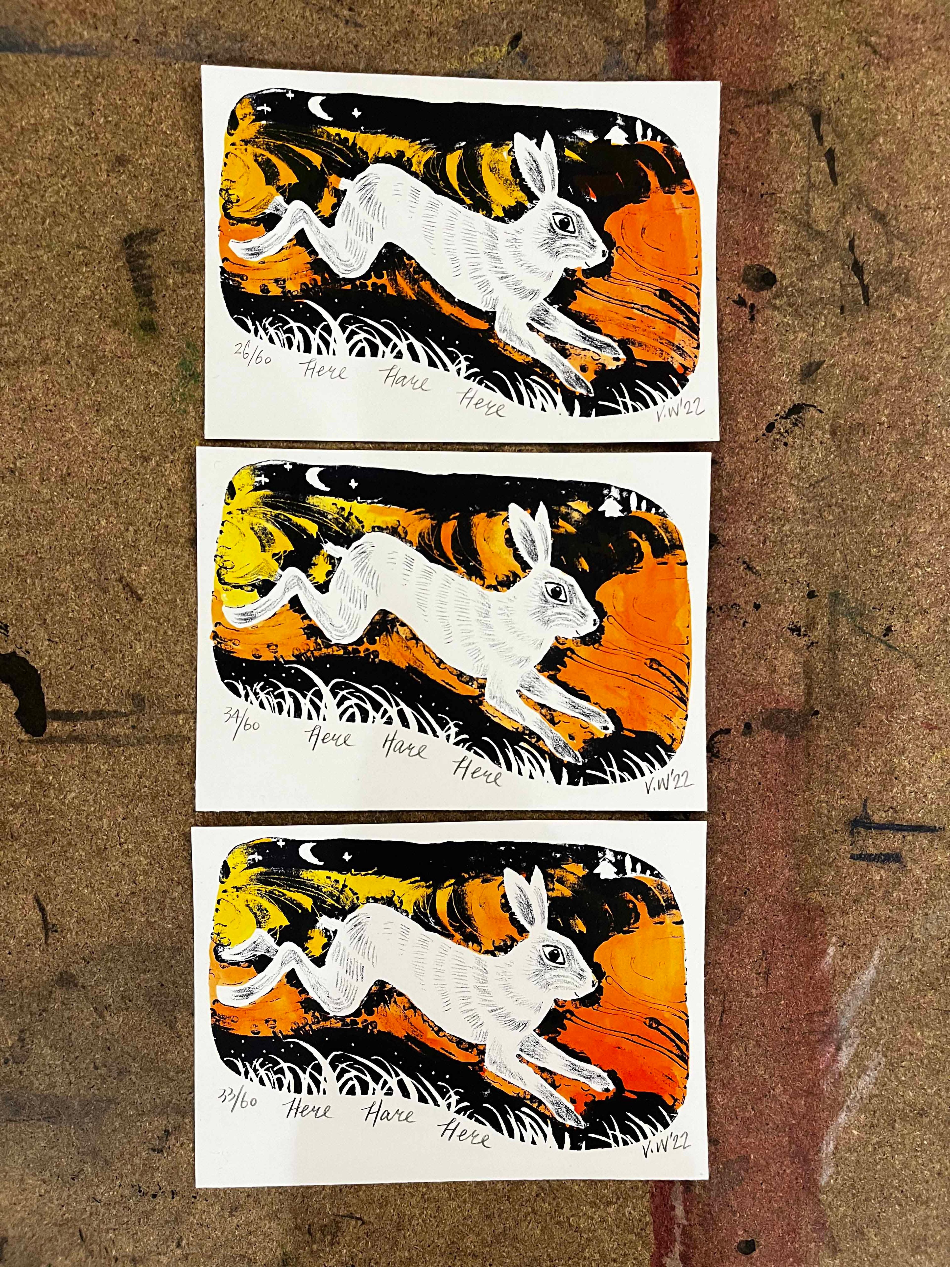 Three lithography prints of a colourful rabbit.