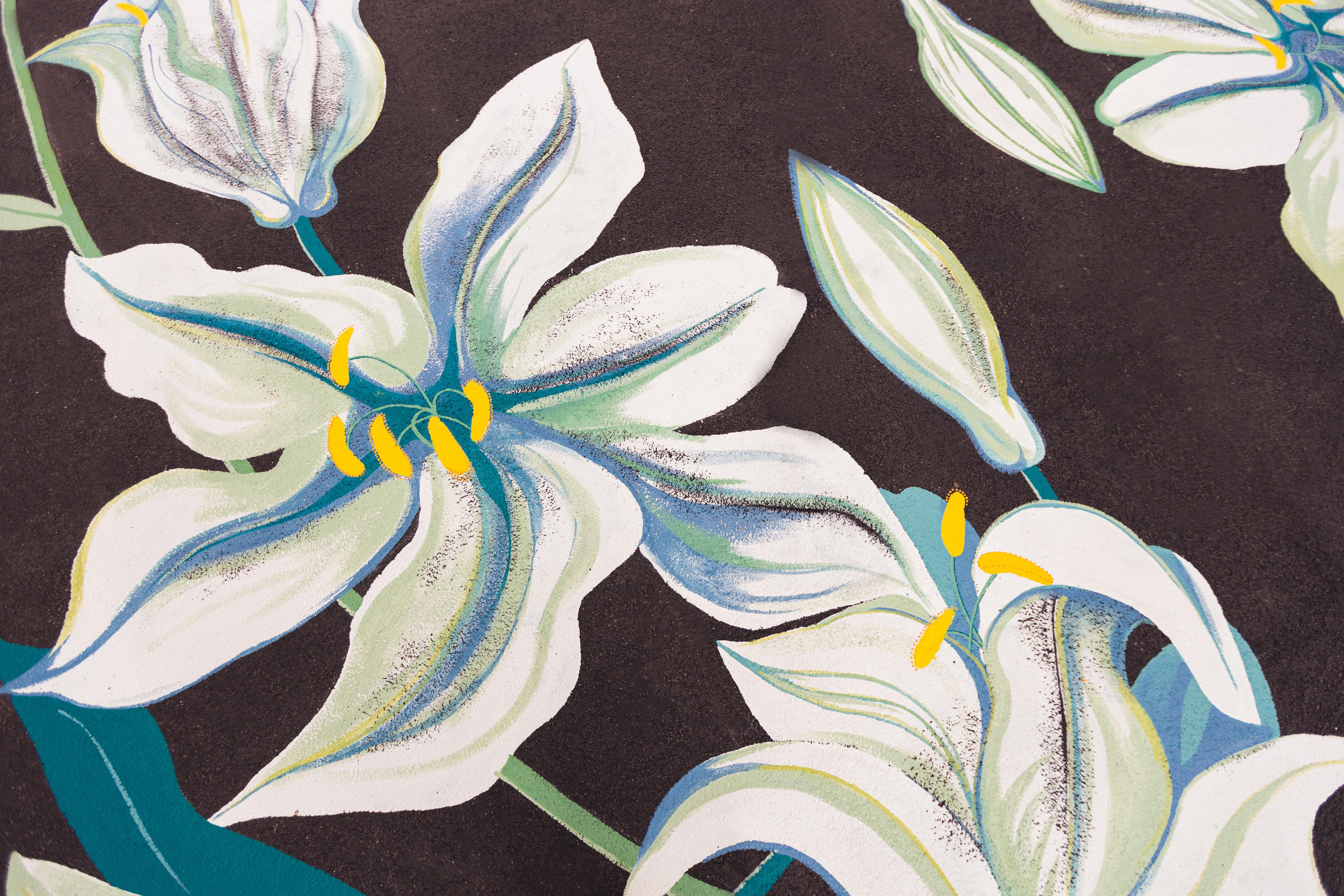 Detail of mural - white flowers with blue leaves set against a black backdrop