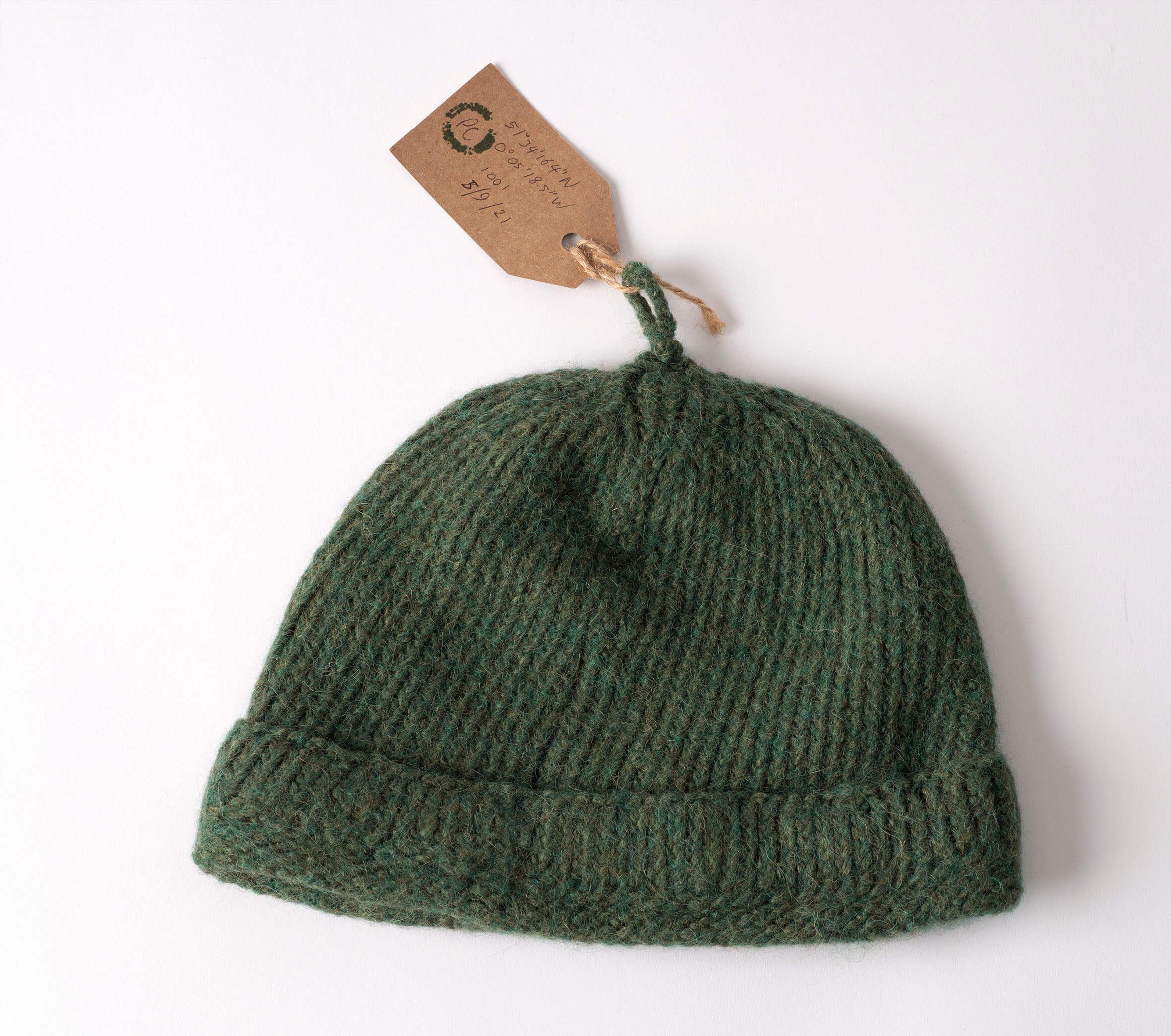 Photograph of a green knit cap.
