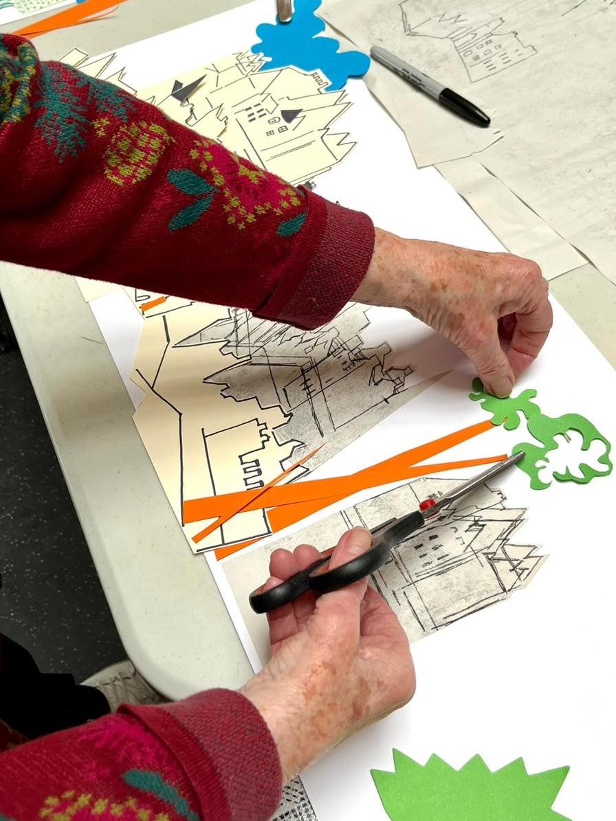 Pair of hands making a collage.