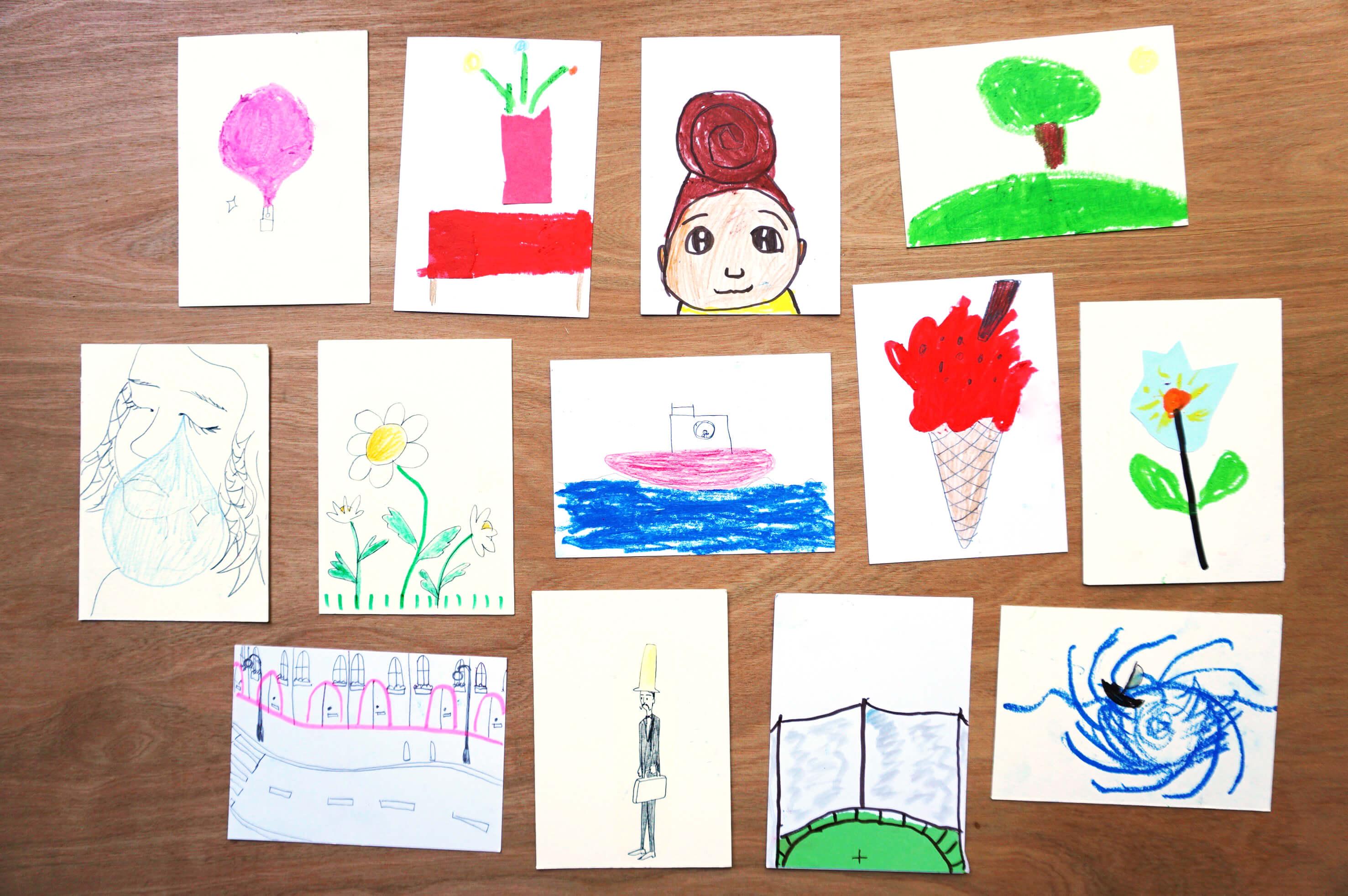 Illustrated cards arranged on a wooden surface