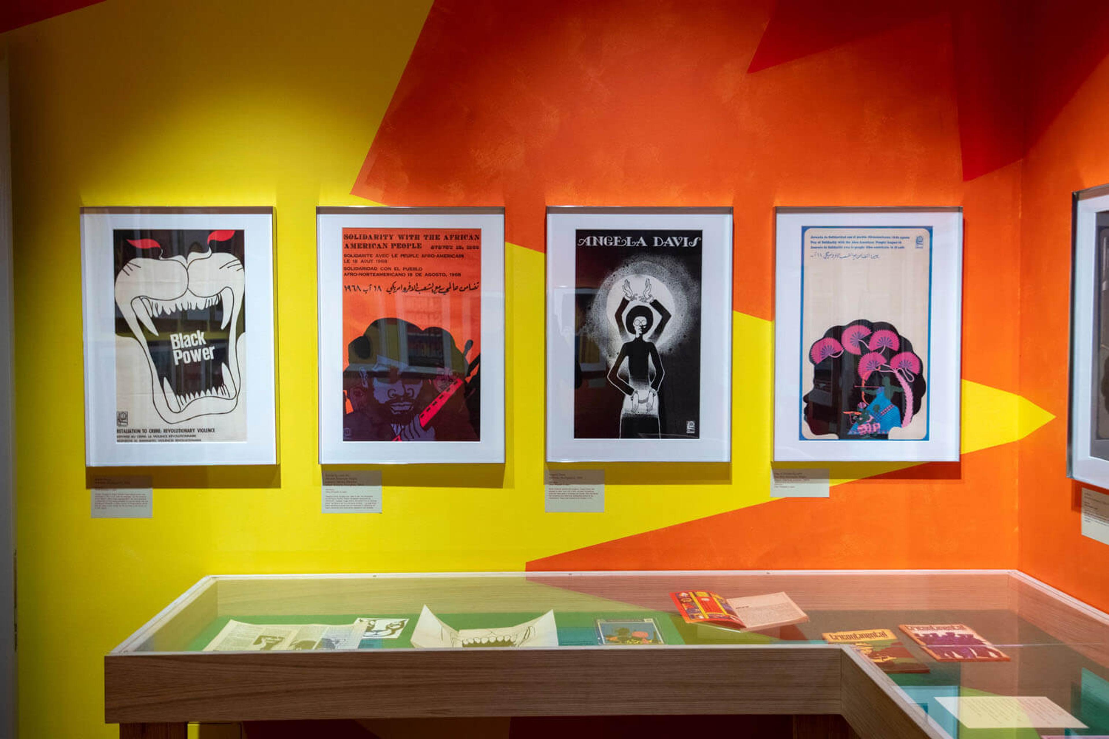 A colourful wall with four frames graphic illustrations