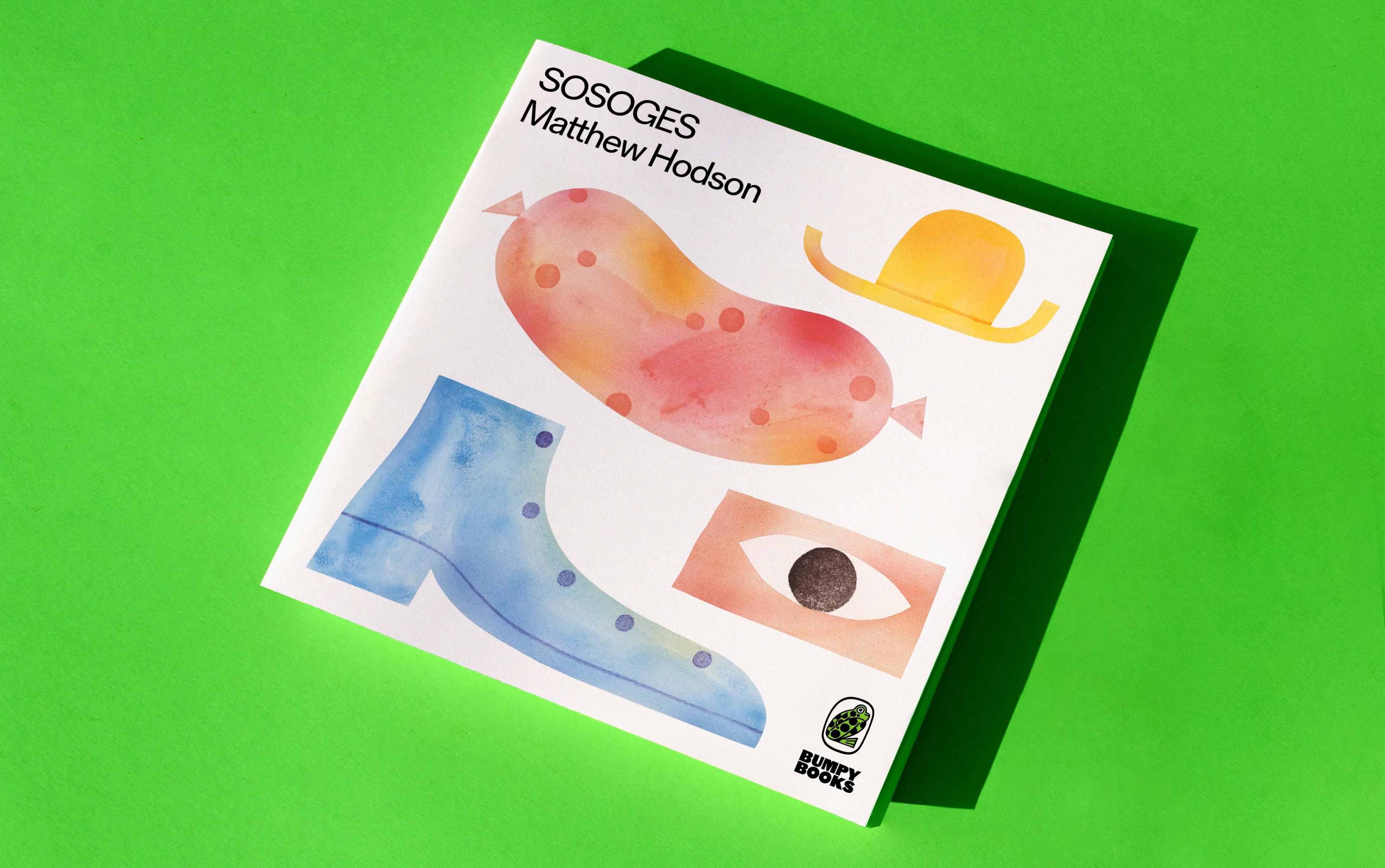 A copy of a book on a green background.