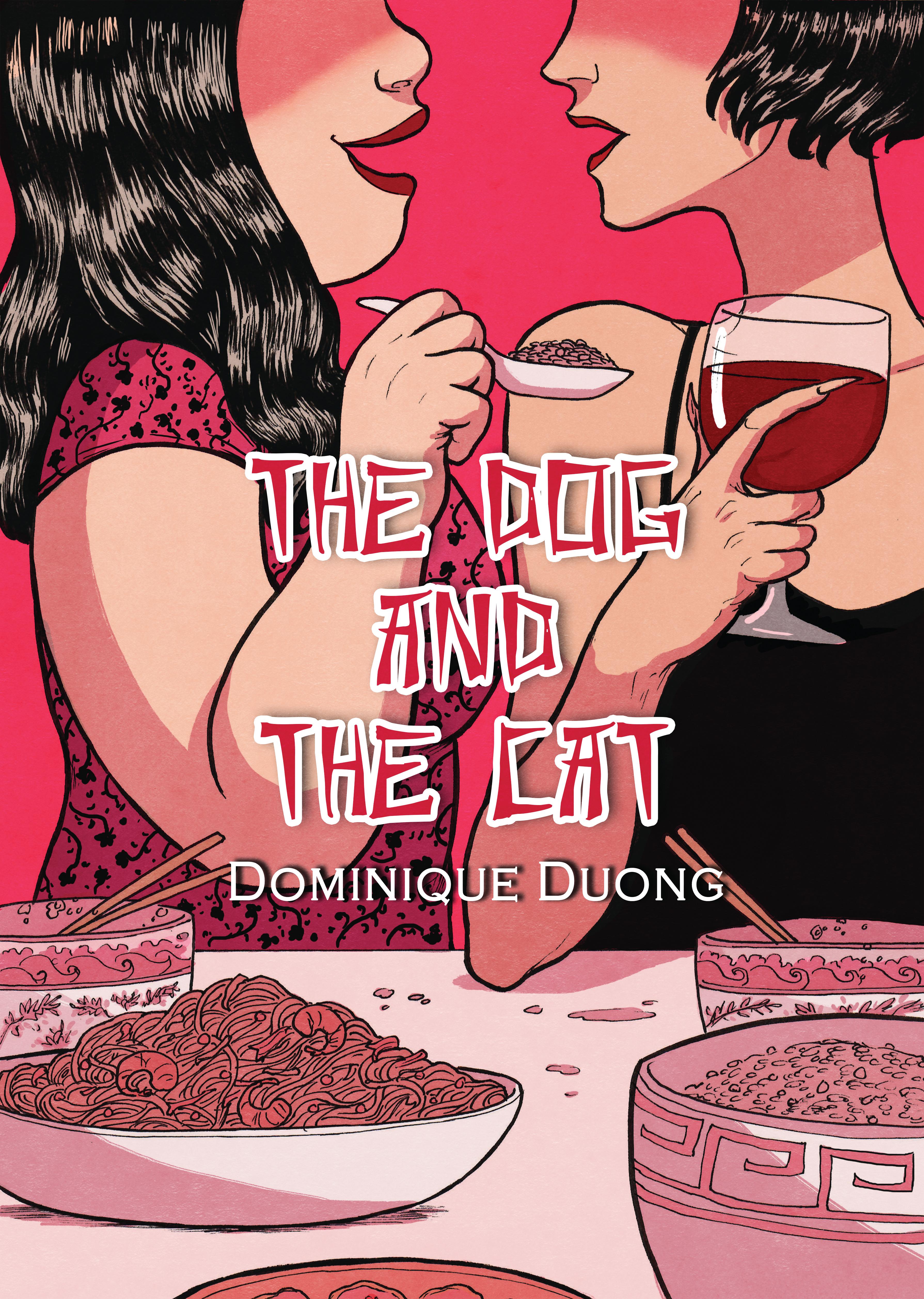 Two women sit next to each other at a dinner, one holding a glass of wine and the other holding a spoon with food.