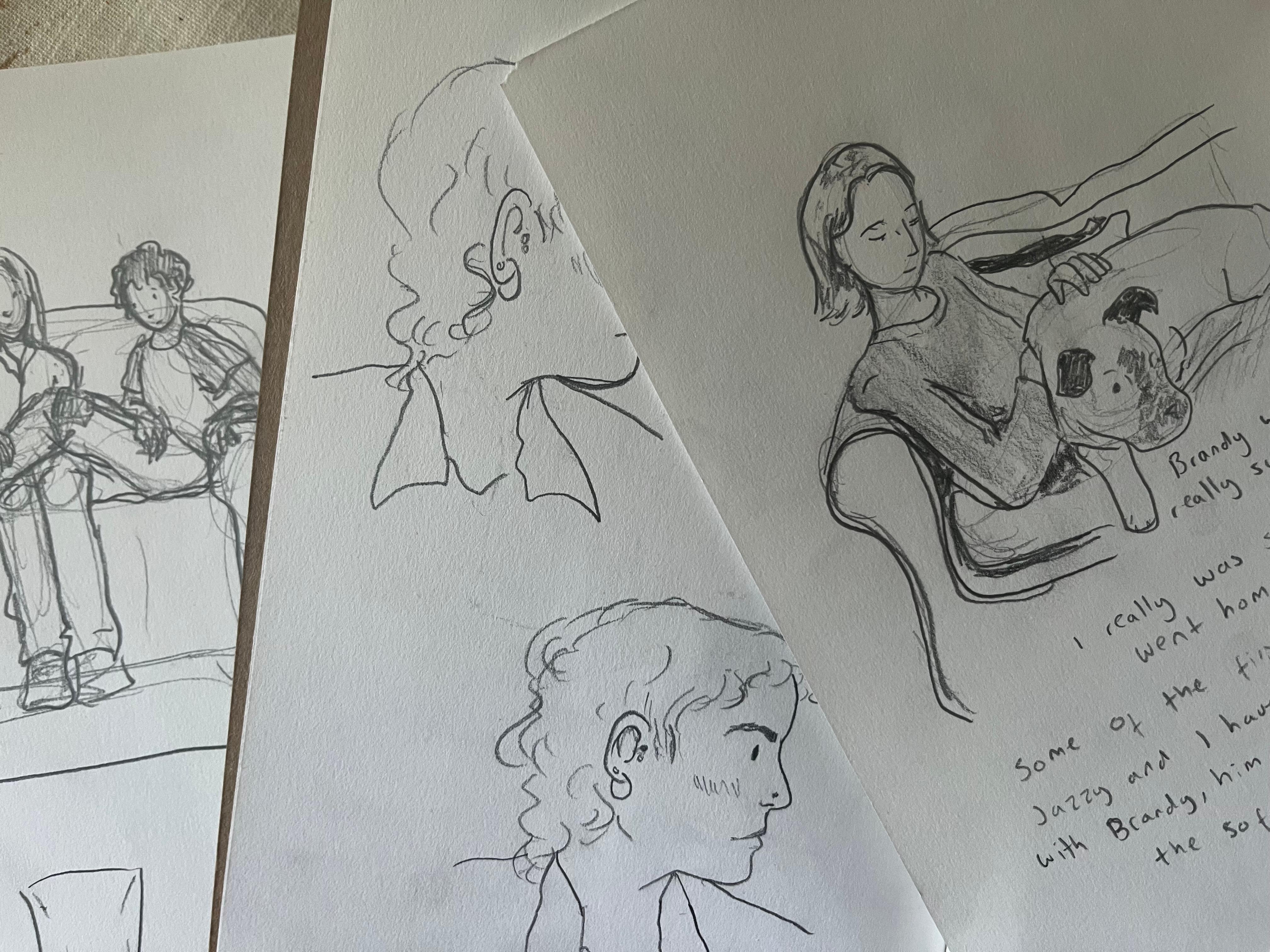 Three pencil sketches on white paper: one of two figures sitting on a couch with a dog, another sketch of a profile of a person with curly hair, and a third sketch of a person with their arm around a dog on a couch.