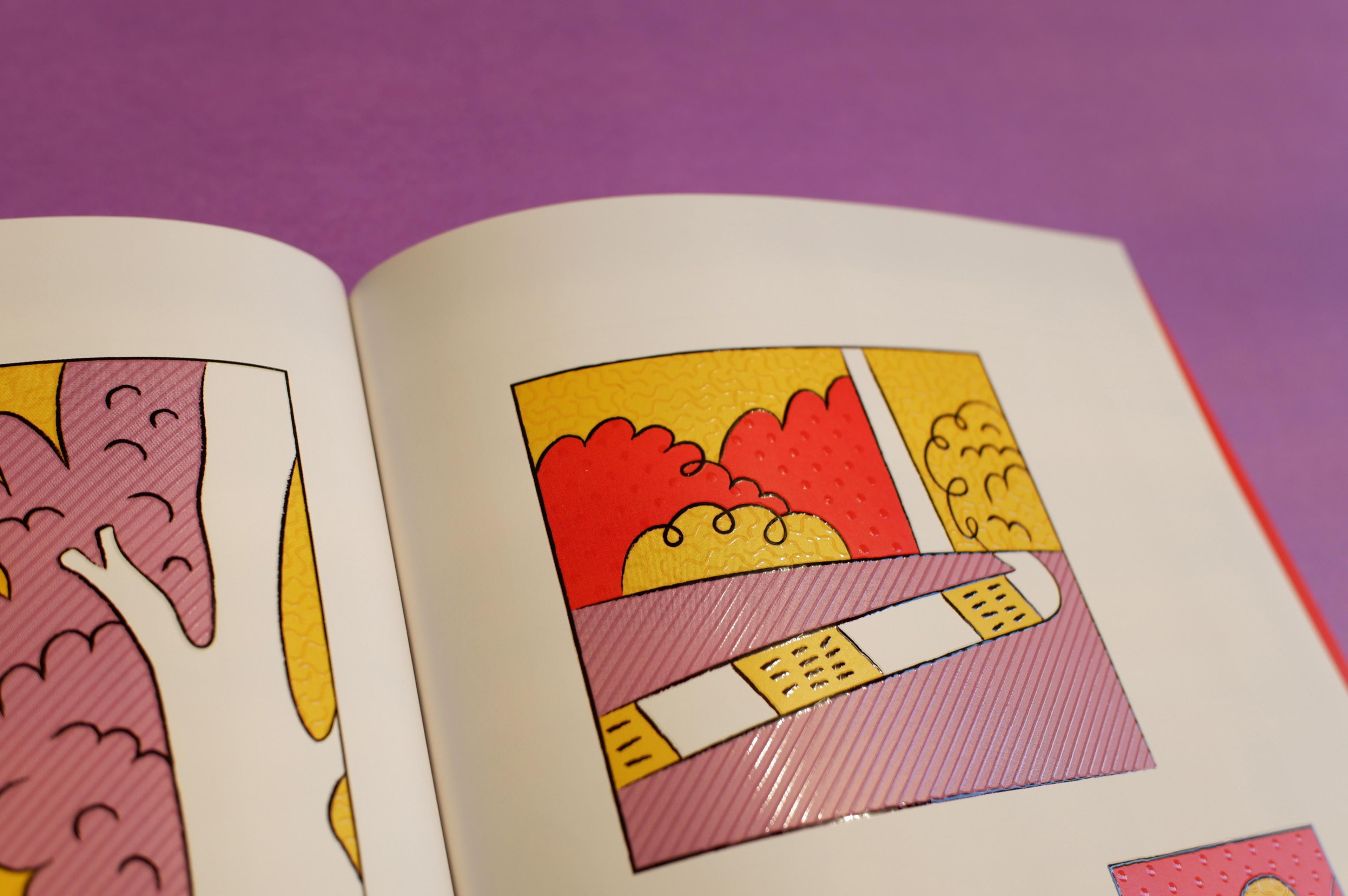 The top part of the page of an open book, with colourful illustrations. On top of the illustrations are a translucent texture that you can see the light bouncing off of.