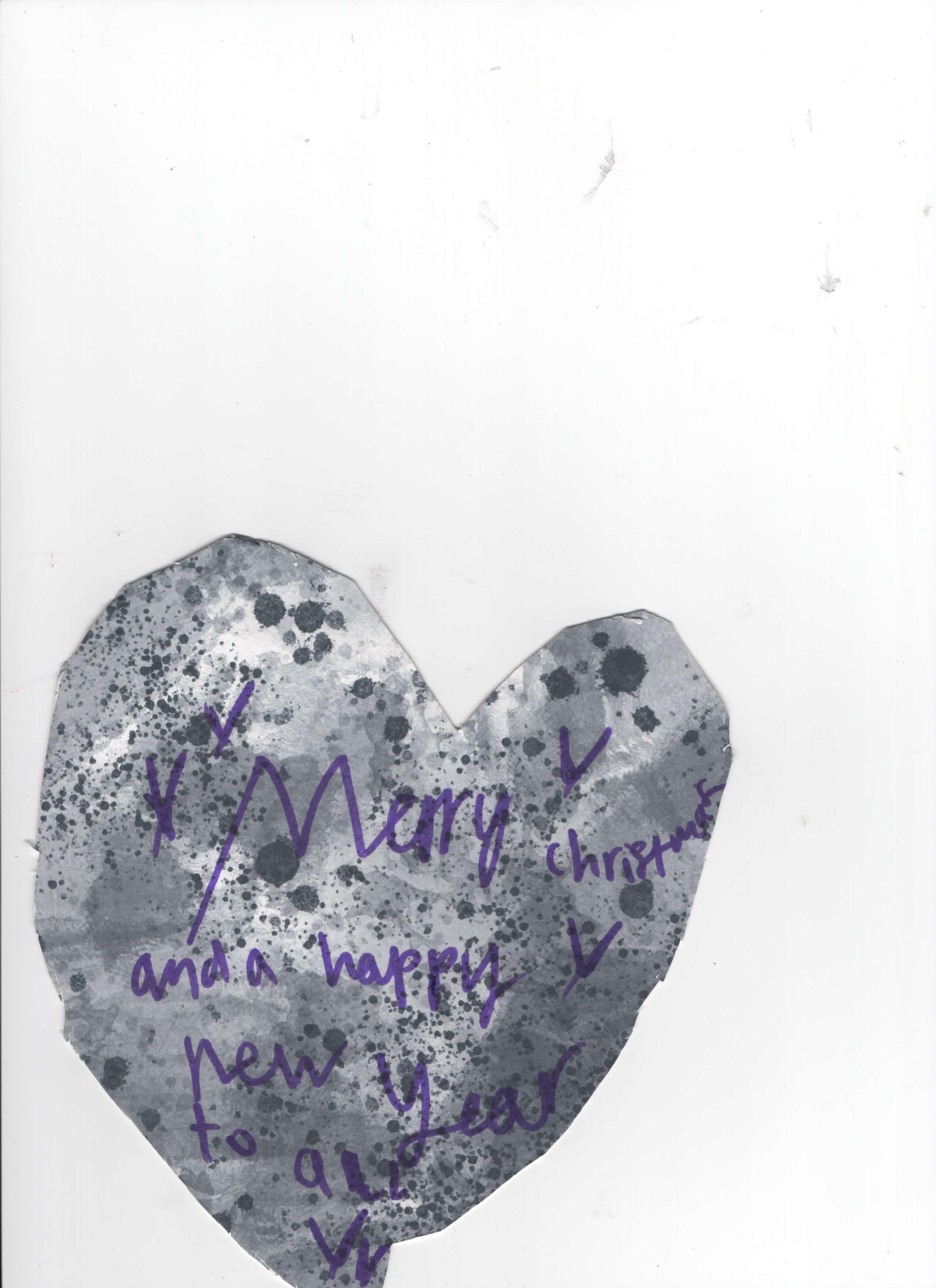 A gray cut-out heart with the words "Merry Christmas and Happy New Year to all".