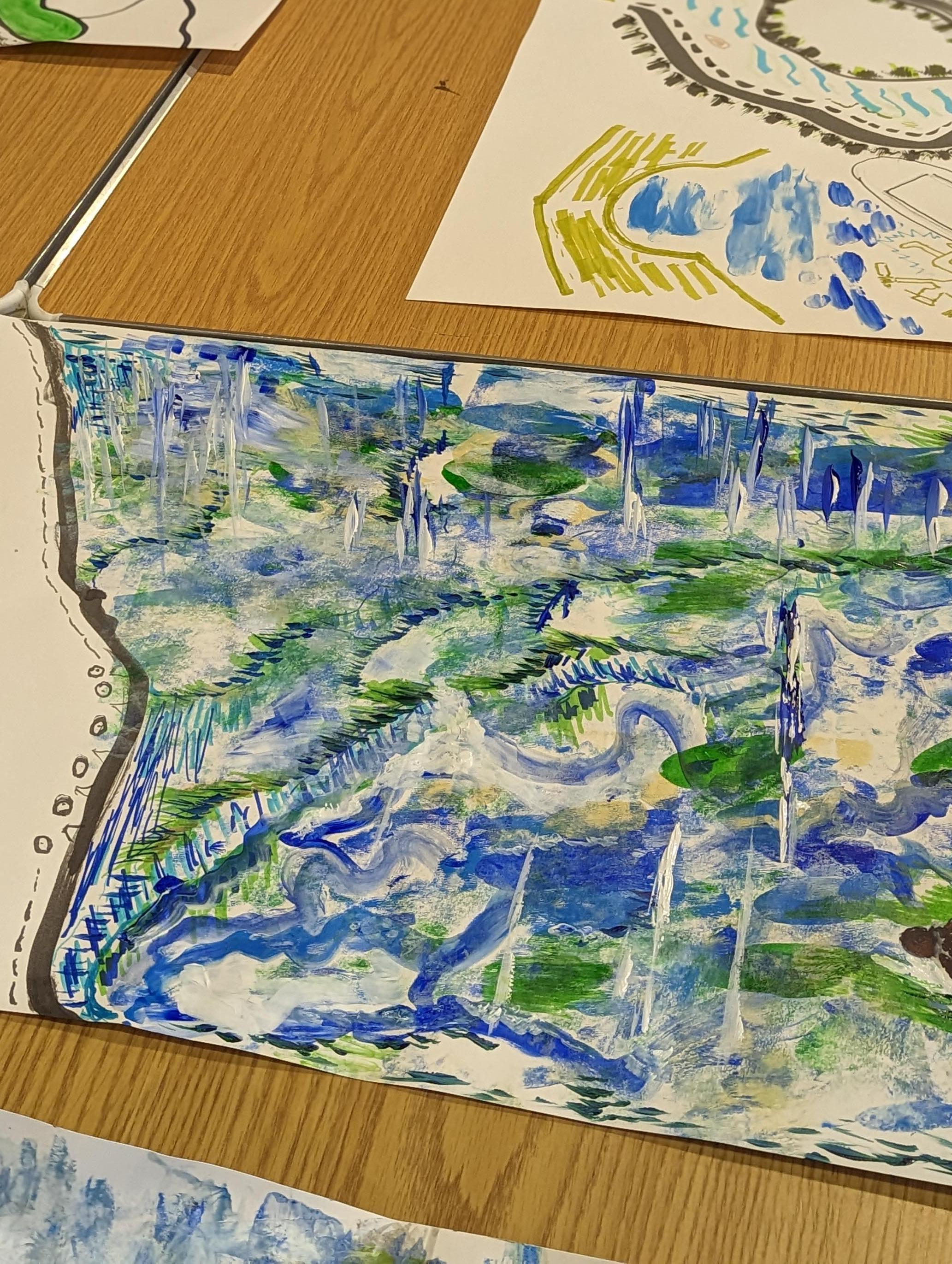 Sheets of illustrated paper on a table.