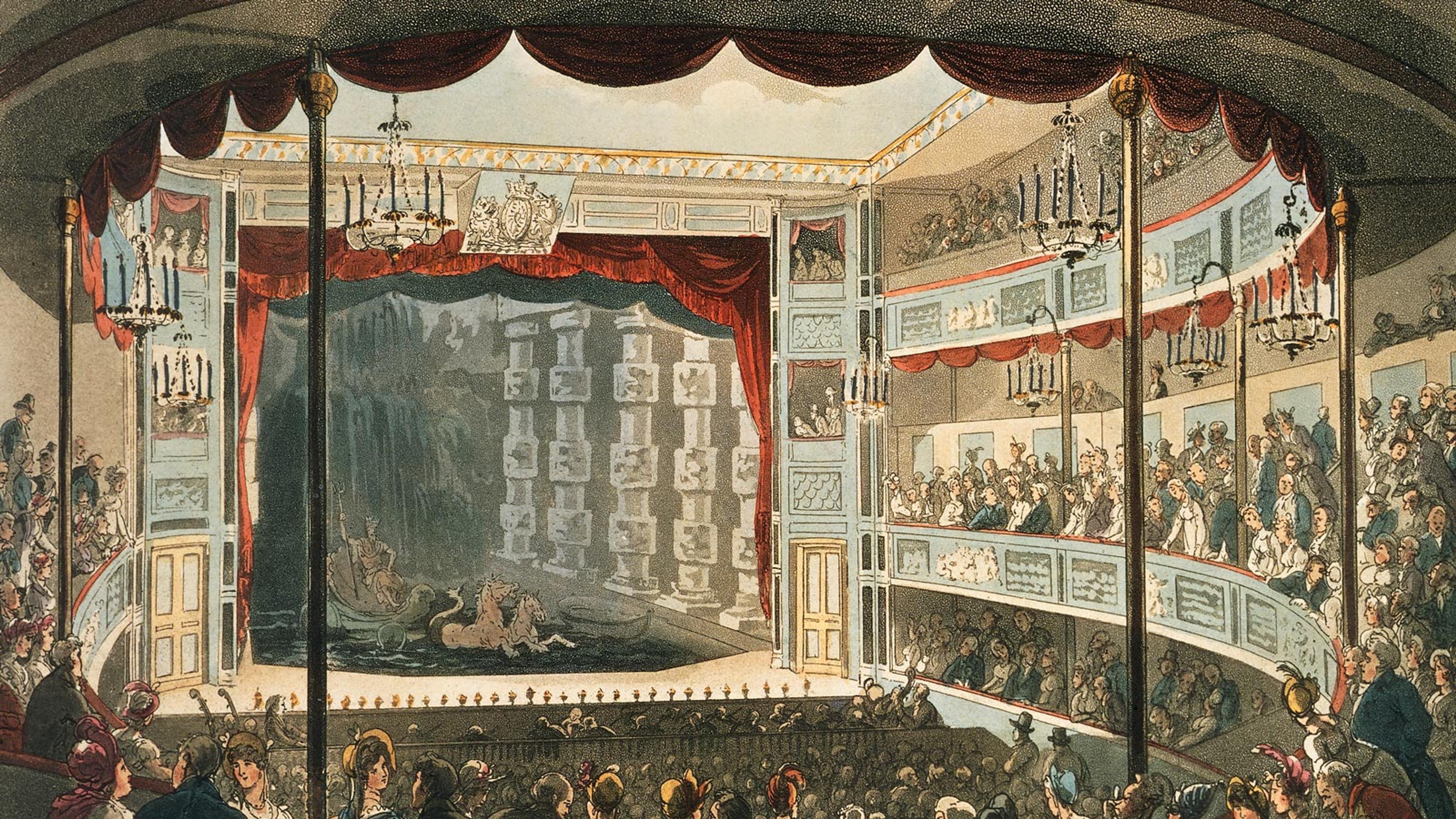 interior of a theatre with an audience watching a stage that has a sunken tank of water with horses in it and a person in a shell floating on top