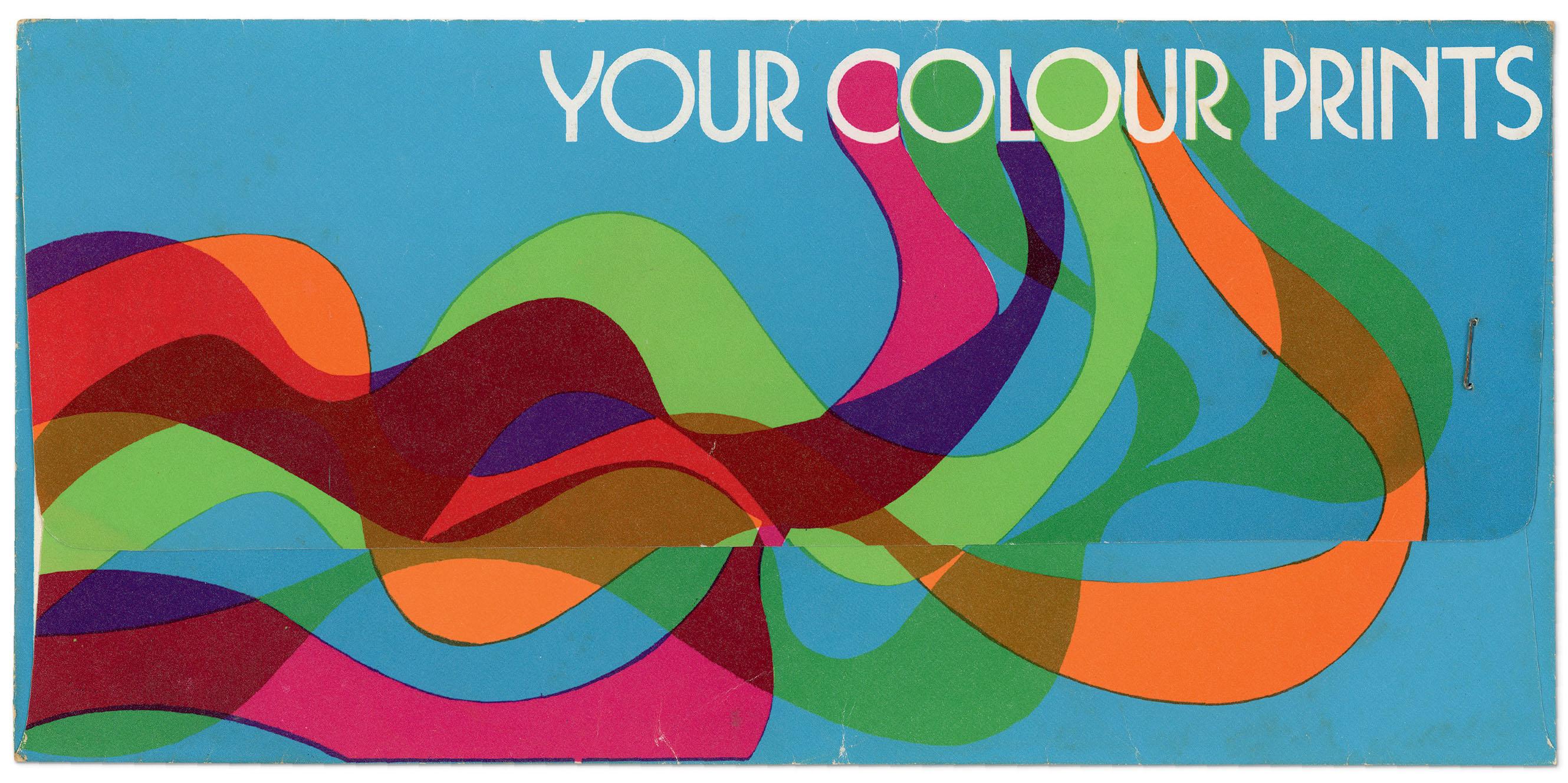 Photo of an envelope with colourful wavy lines with the text 'YOUR COLOUR PRINTS'.