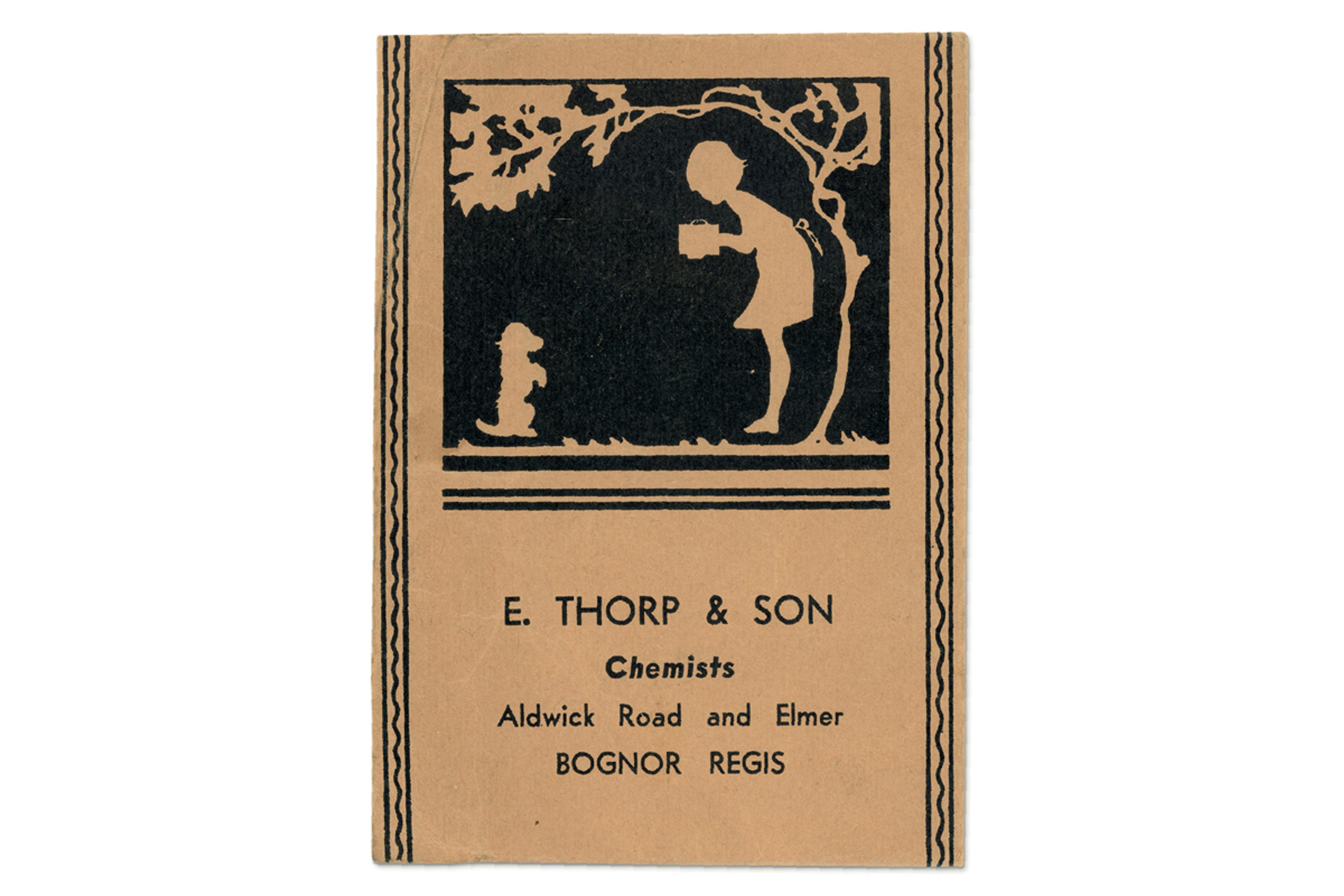 Photo of an envelope featuring a silhouette of a person taking a photograph of a dog by a tree, with the text 'E. Thorp & Son', 'Chemists', 'Aldwick Road and Elmer' and 'Bognor Regis.