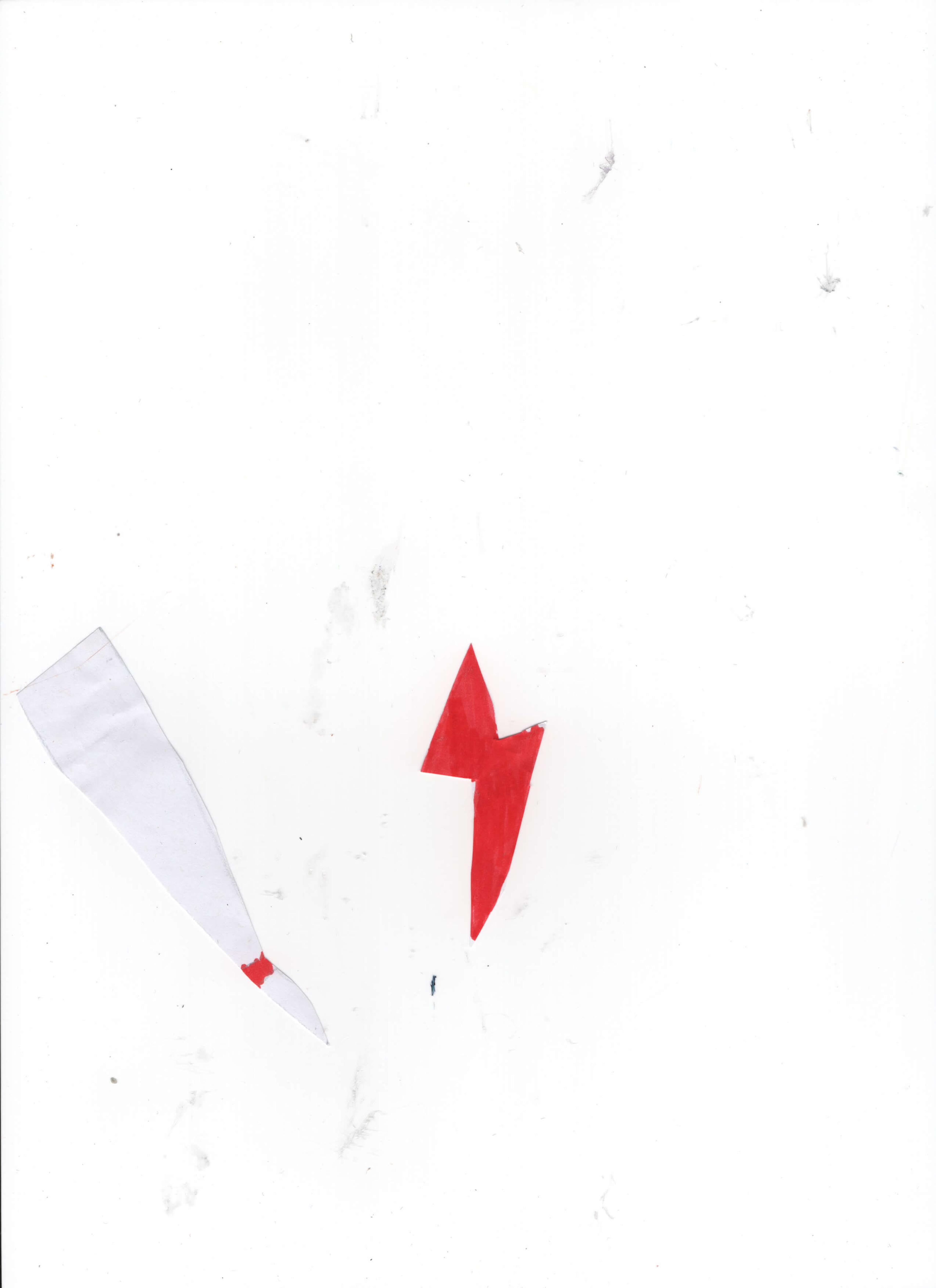 Paper cut-outs of a red lightning bolt and a white triangle with a red strip.