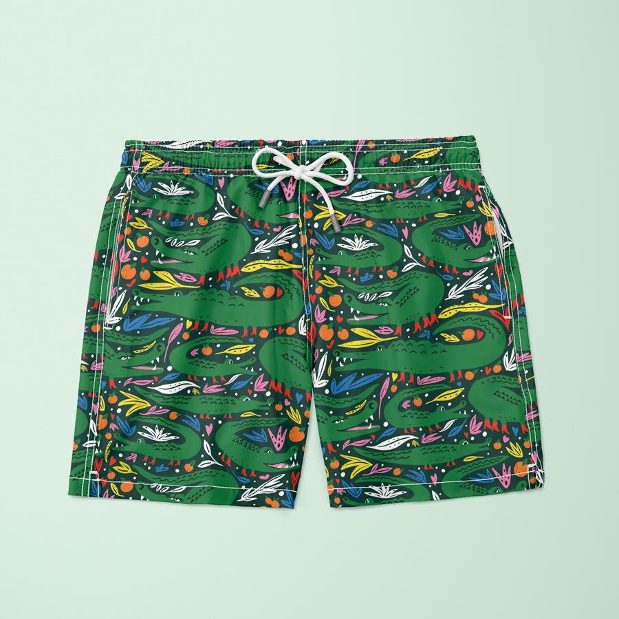 A pair of swim shorts with an alligator pattern. 