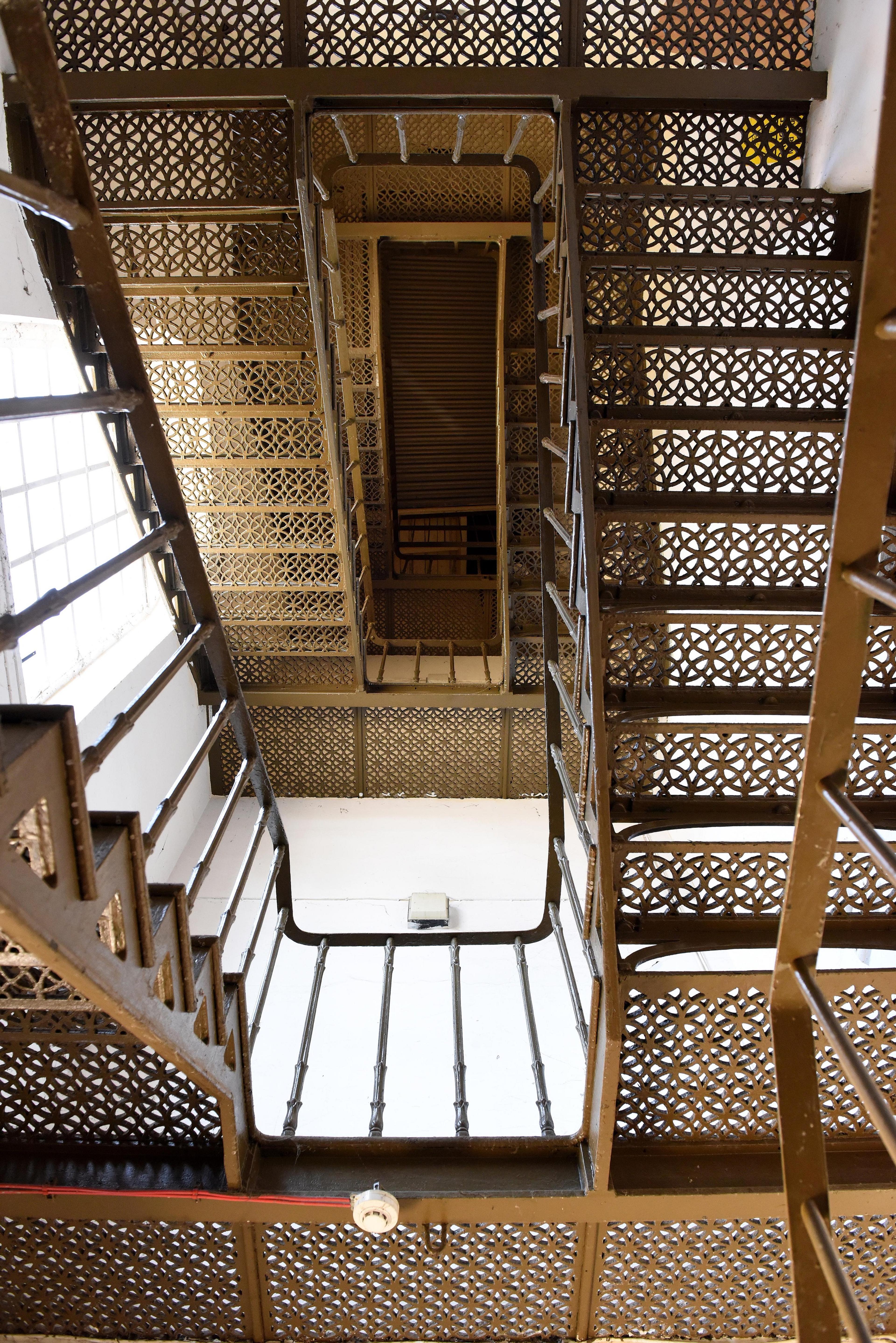 Photograph of decorative metal staircase seen from below