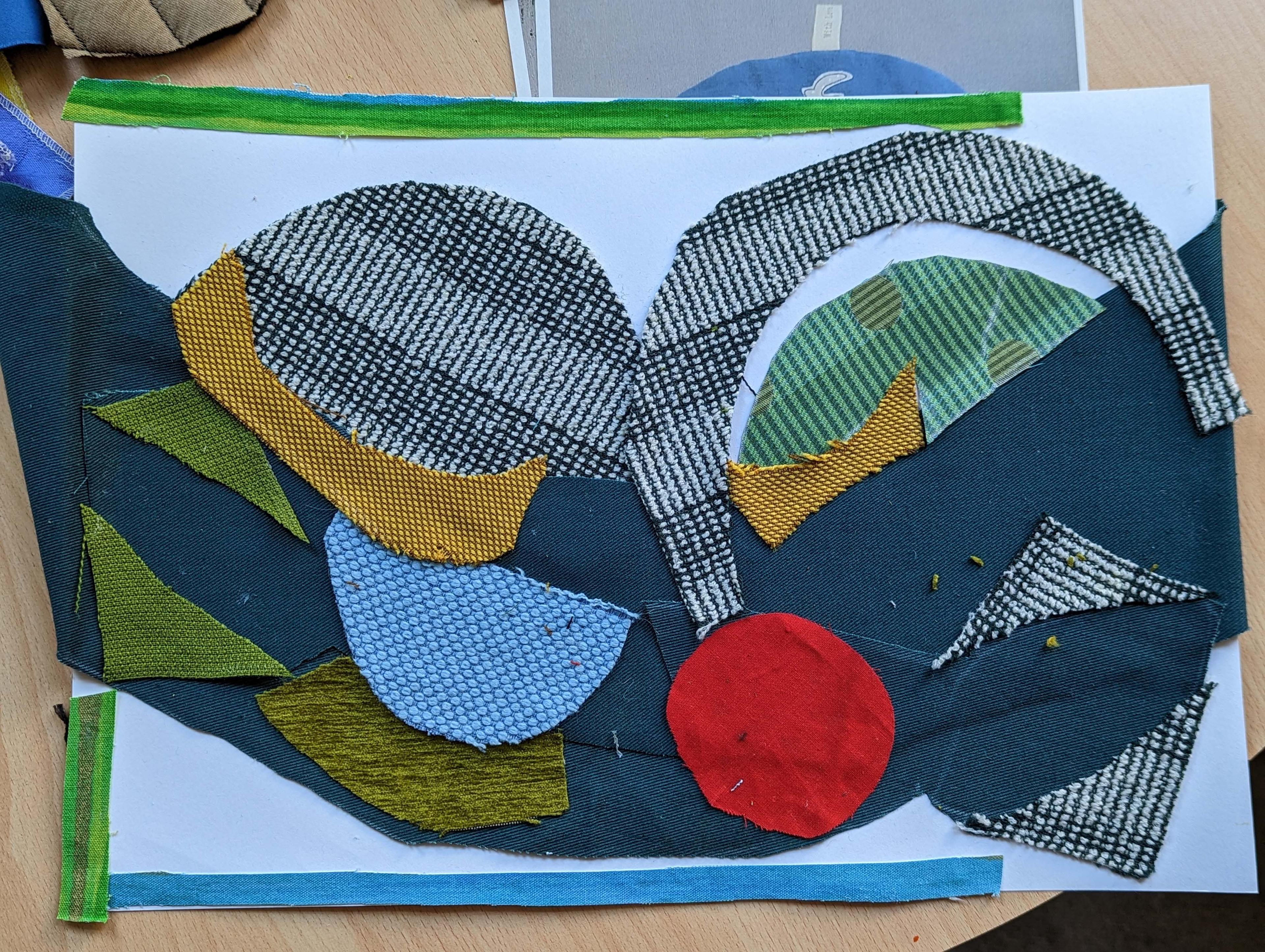 Fabric collage on paper.