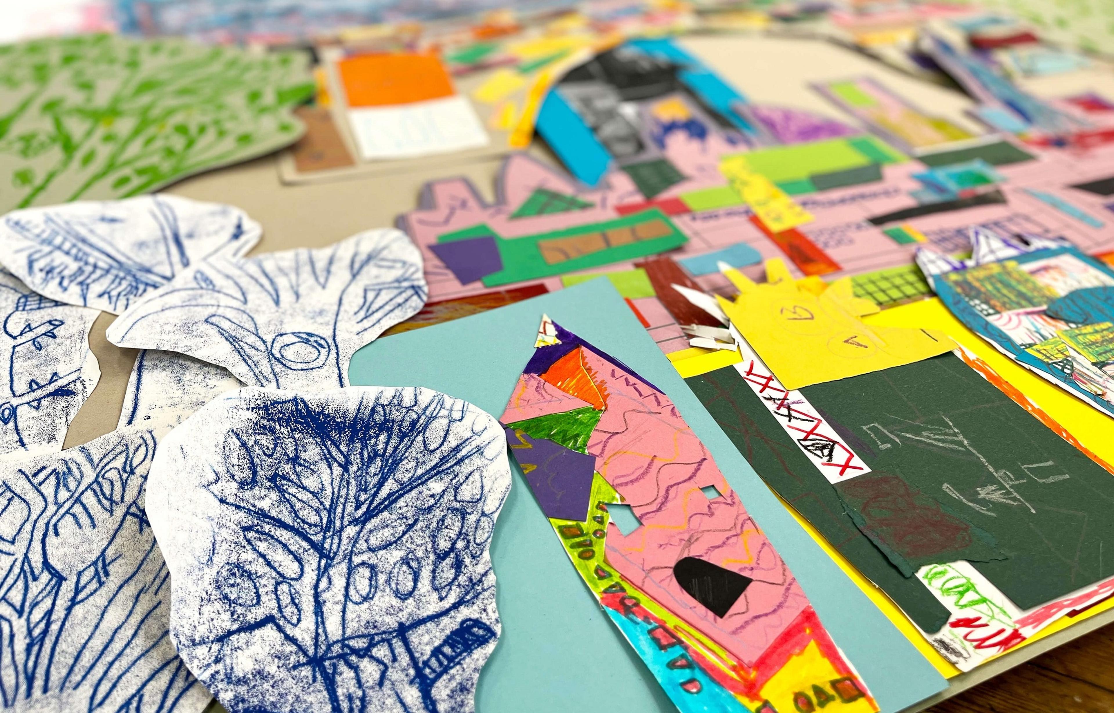Collage made from coloured and printed paper showing buildings and trees