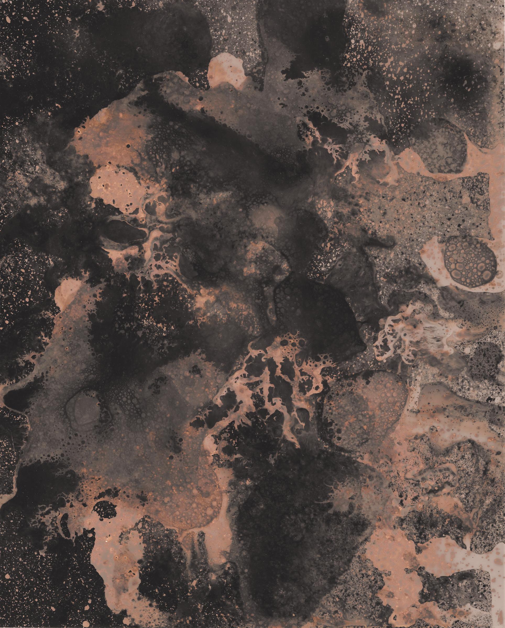 Abstract print with dark and light contrasting elements made by bubbling liquids and drips