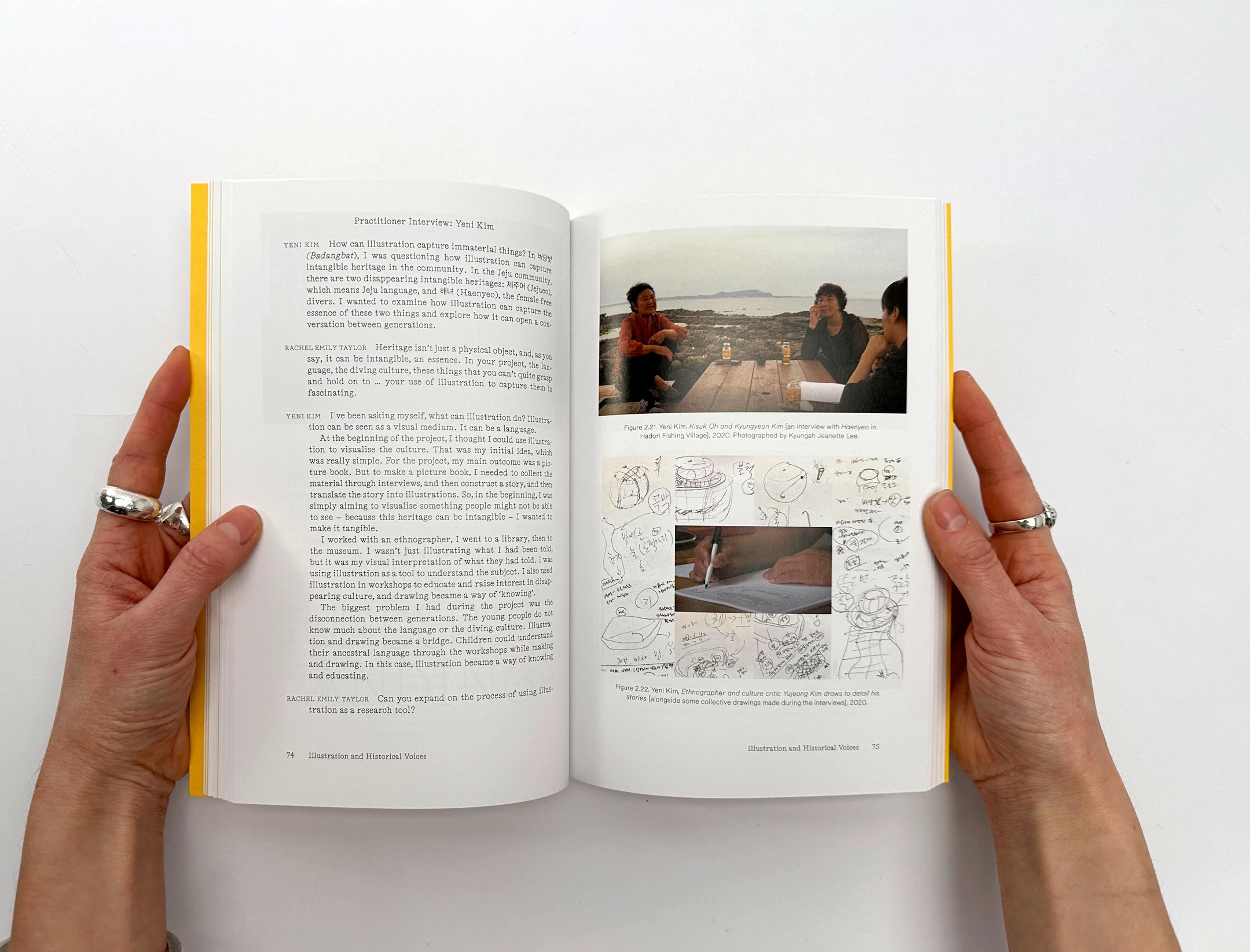 Photograph of two hands opening up a copy of the Illustration and Heritage book.