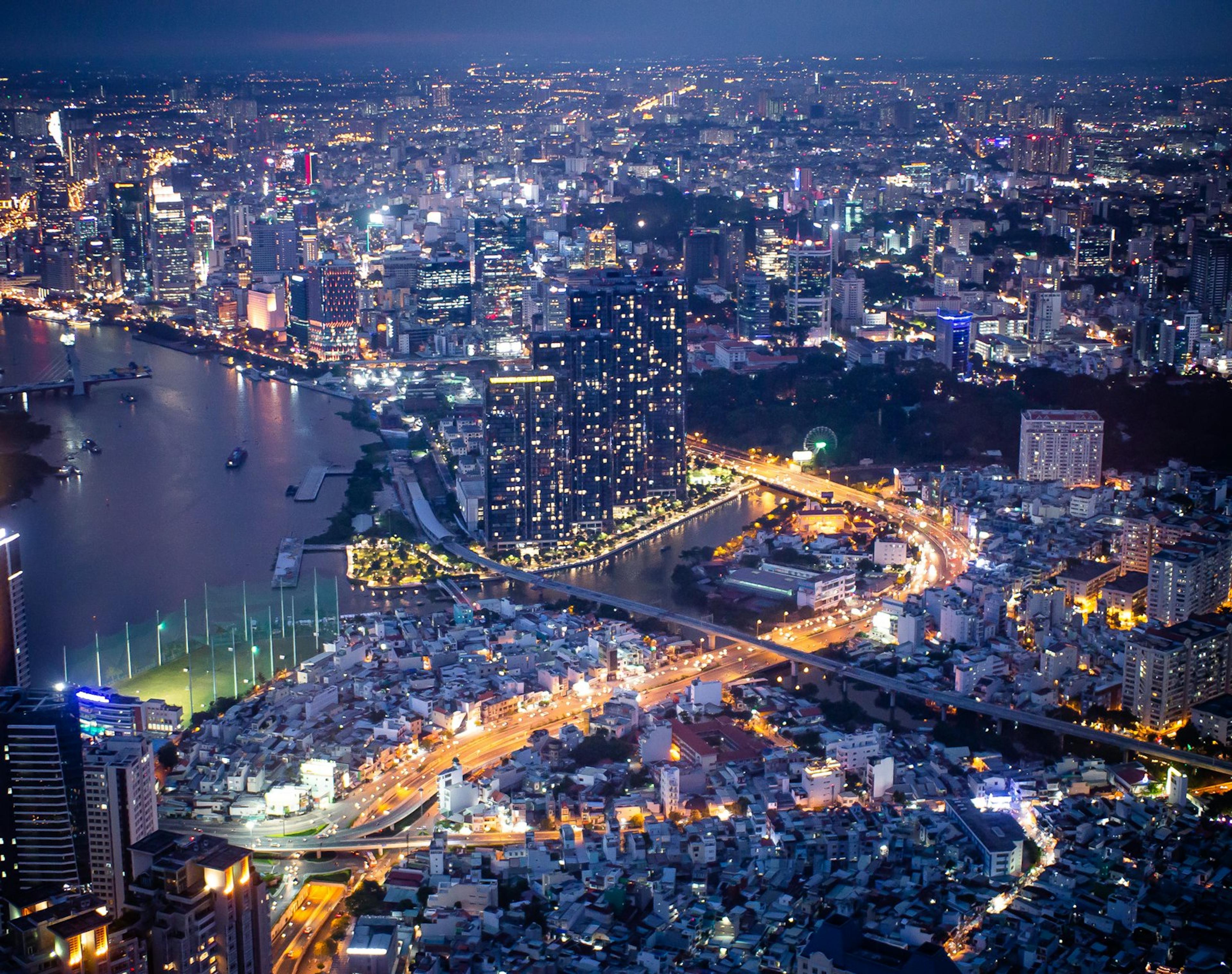 Ho Chi Minh City at night from Landmark 81, with the Saigon River and the lit-up skyline