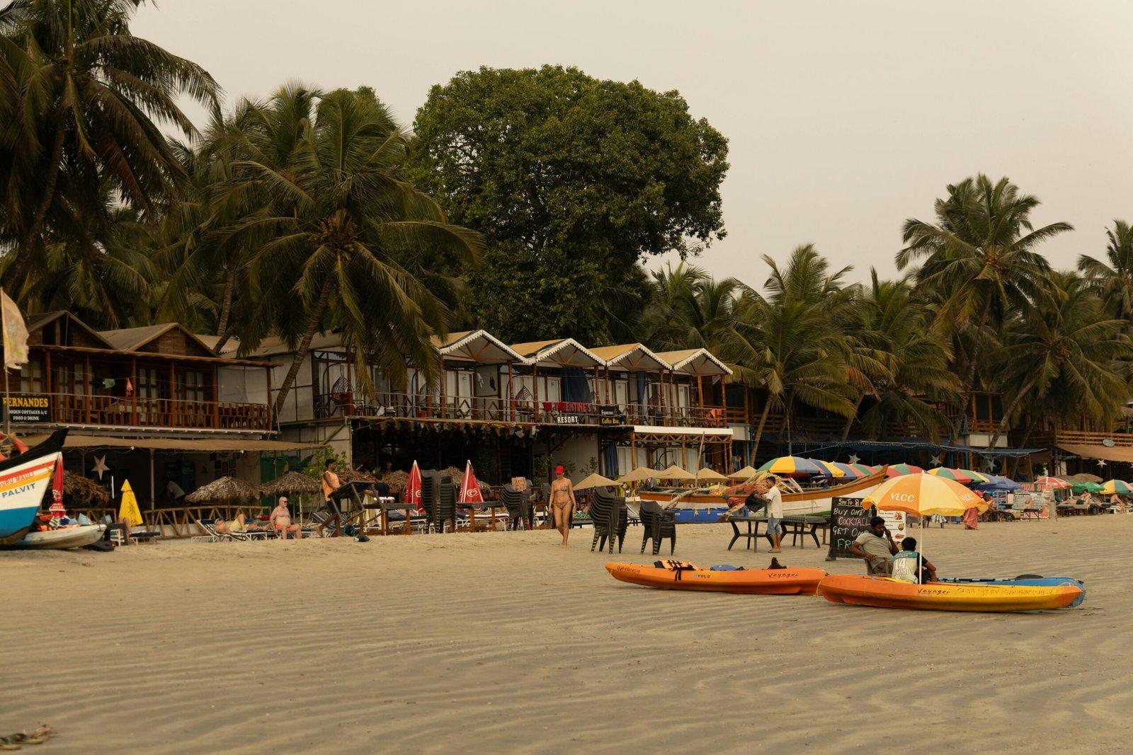 Relaxing beachfront with colorful kayaks, palm trees, and vibrant outdoor seating in tropical setting.