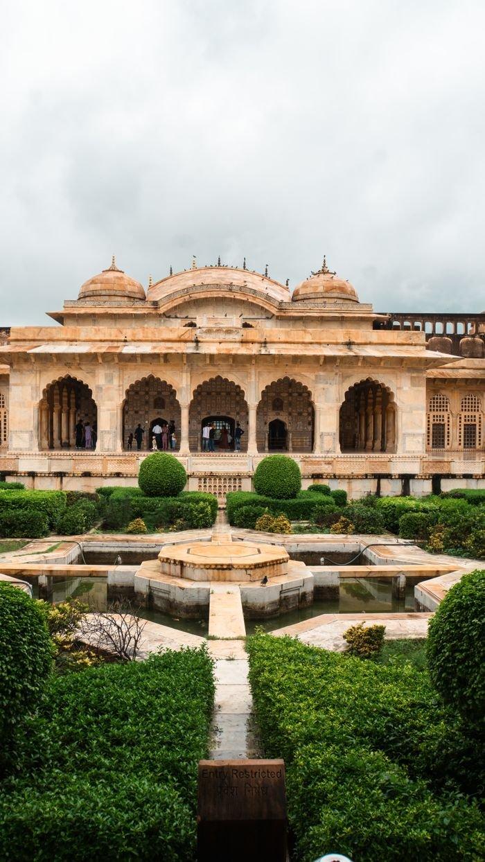 Beautiful garden view of historic architecture in Jaipur, India showcasing traditional design.