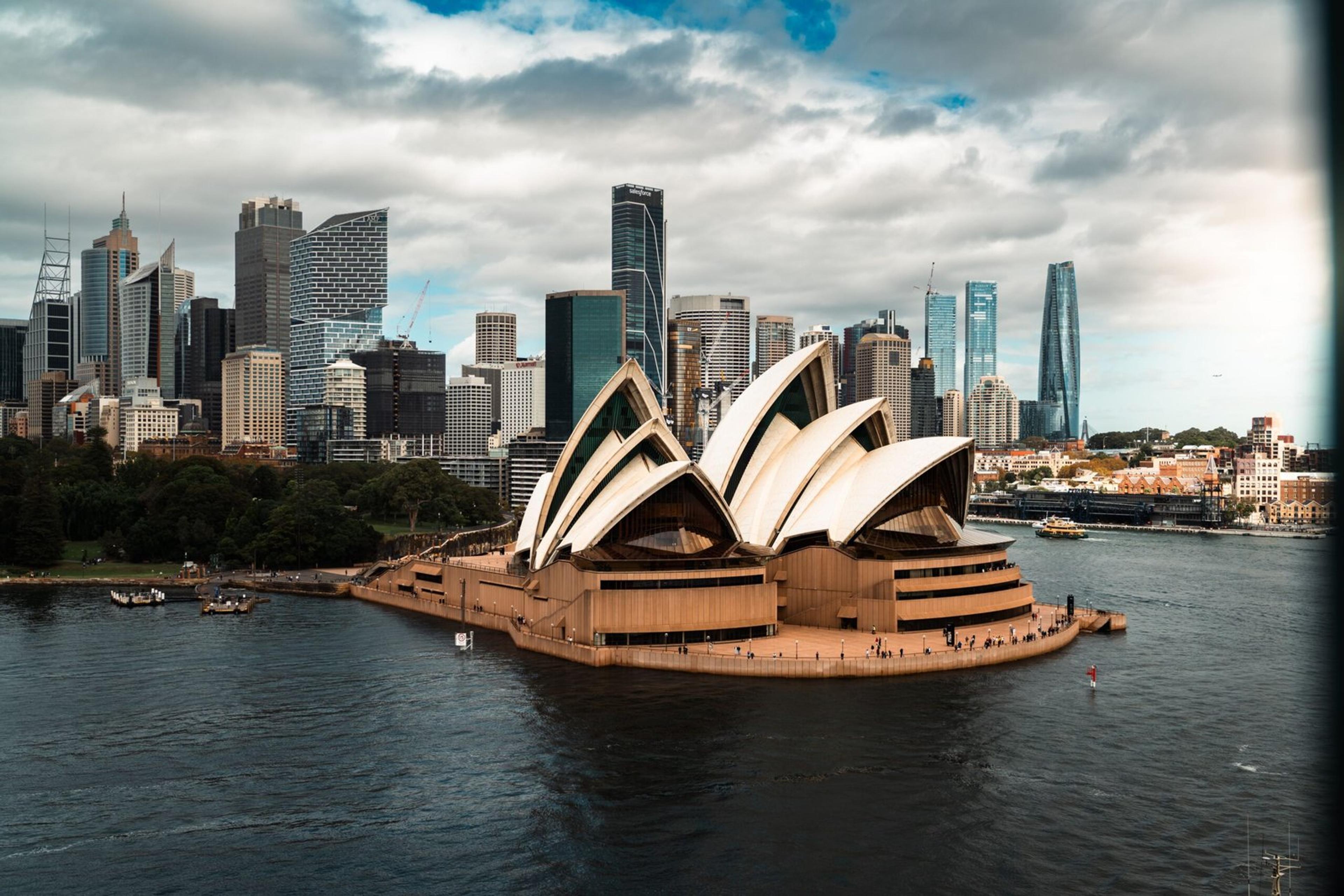 Stunning aerial view of the Sydney Opera House with the city skyline in the background.