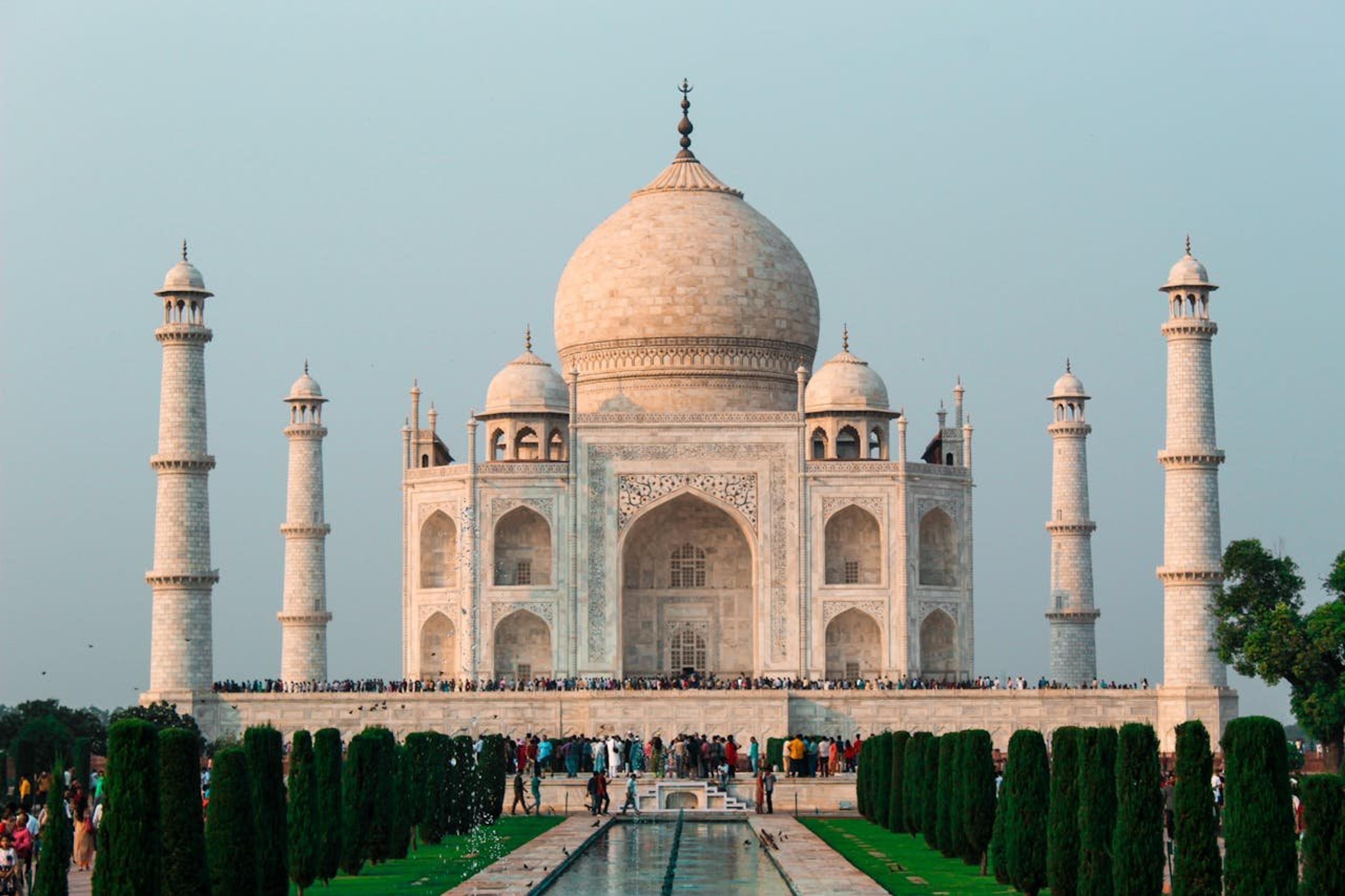 Majestic view of the Taj Mahal in Agra, a world-famous heritage monument, curated by a top travel agency in India with the best tour operators in India.