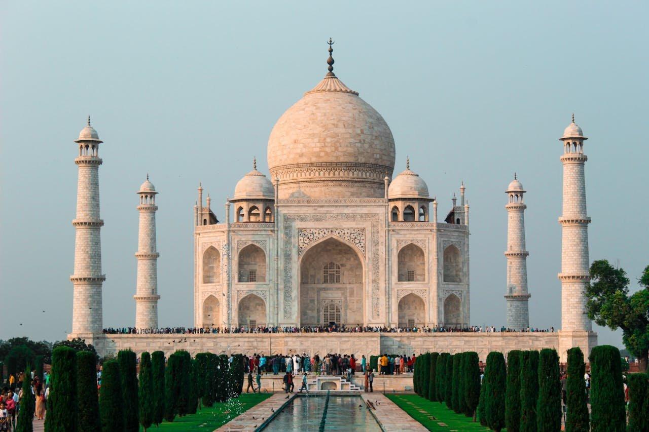 Majestic view of the Taj Mahal in Agra, a world-famous heritage monument, curated by a top travel agency in India with the best tour operators in India.