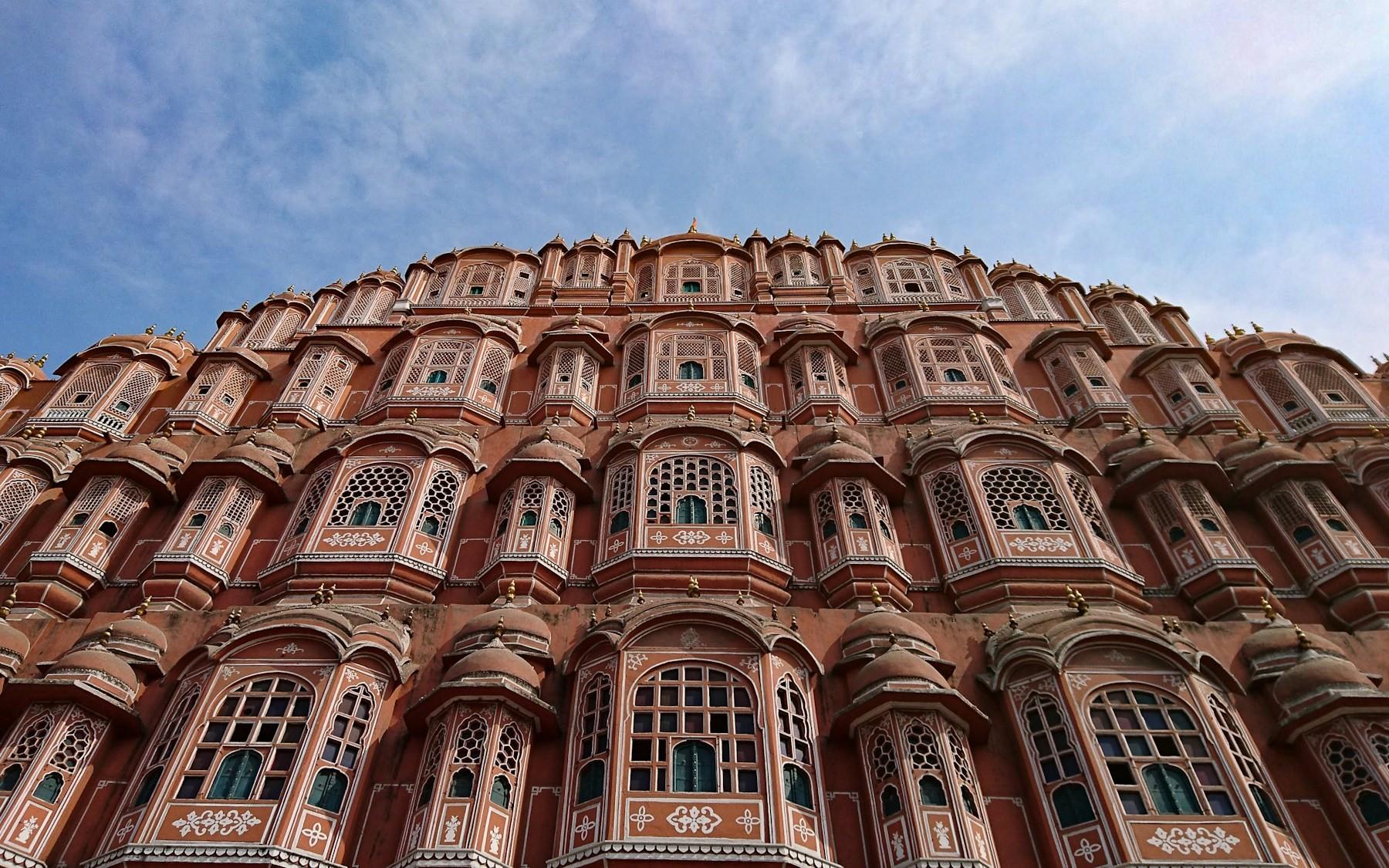 The pink sandstone facade of the Hawa Mahal, the Palace of Winds, in Jaipur