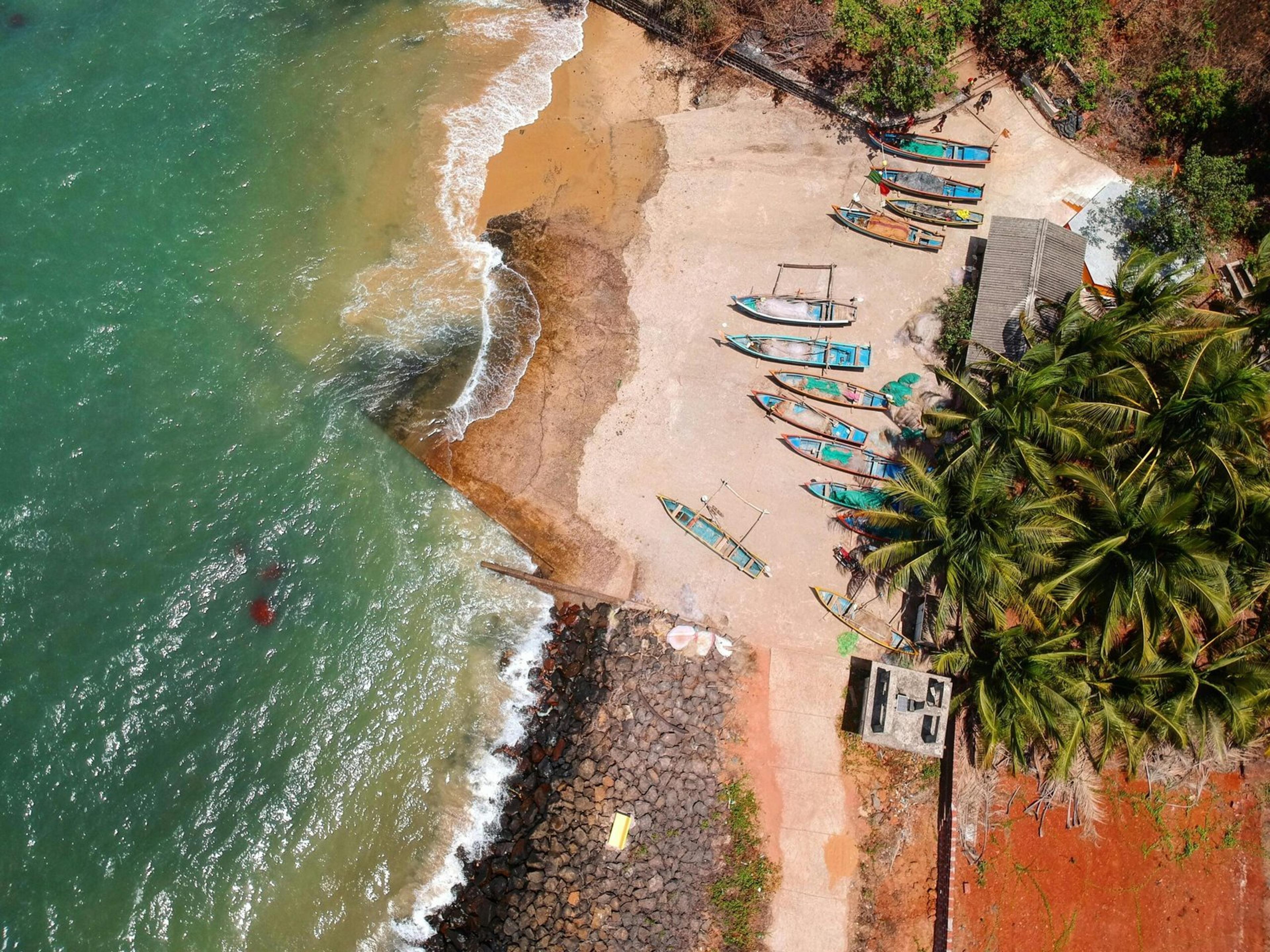 Stunning aerial view of colorful boats by Cosima Holidays: the No.1 Travel Agency in Kochi, Kerala.