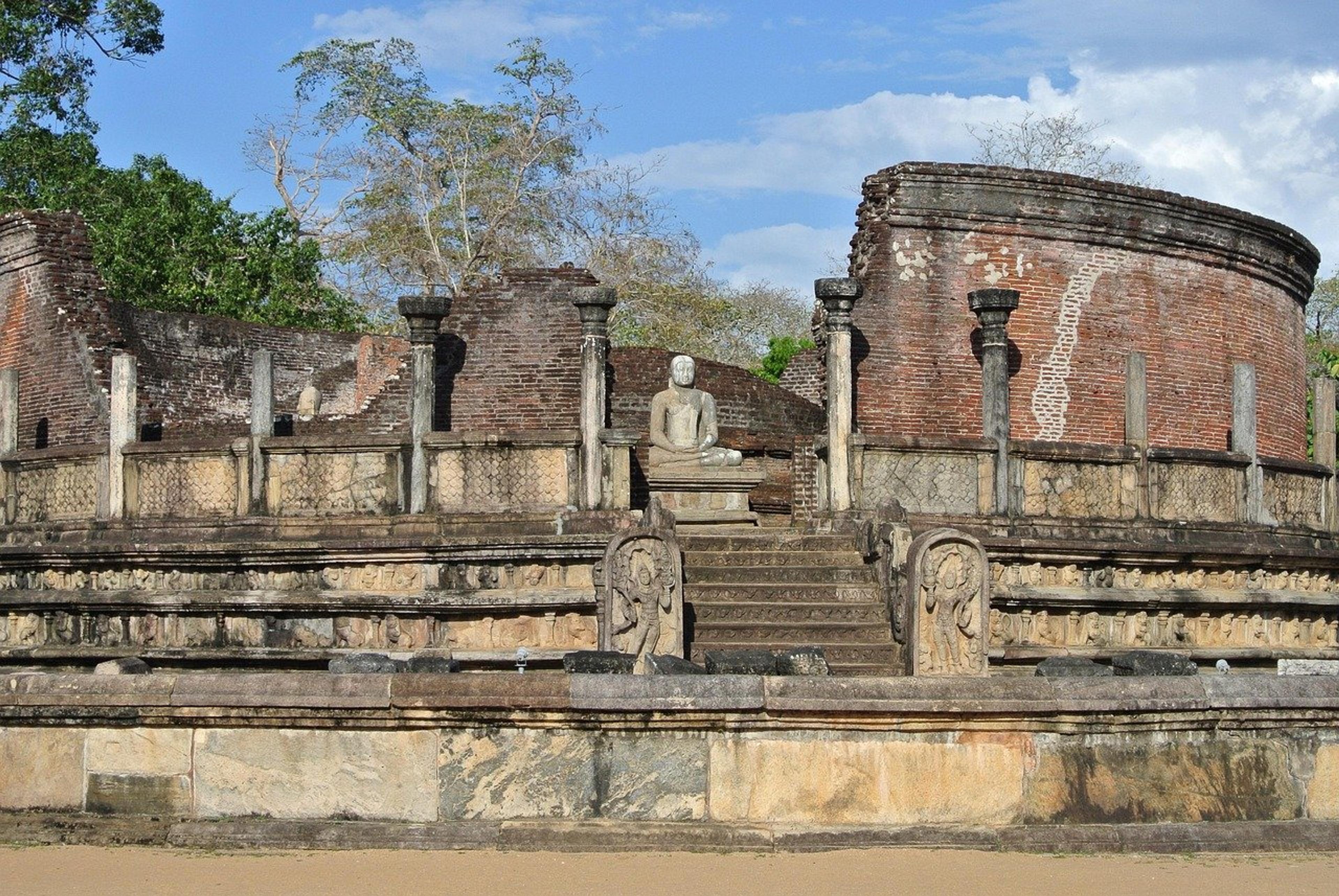 Buddha statue among ancient ruins in Sri Lanka