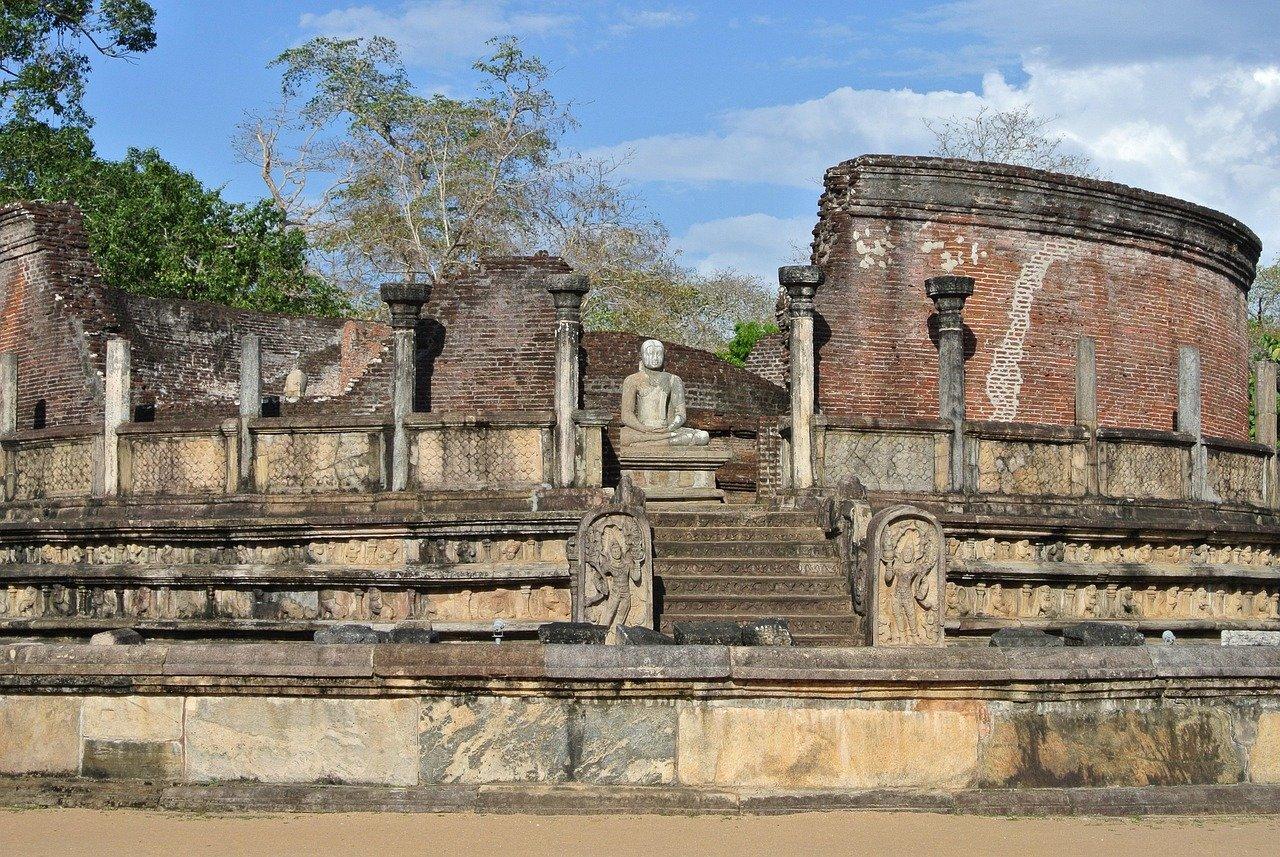 Buddha statue among ancient ruins in Sri Lanka