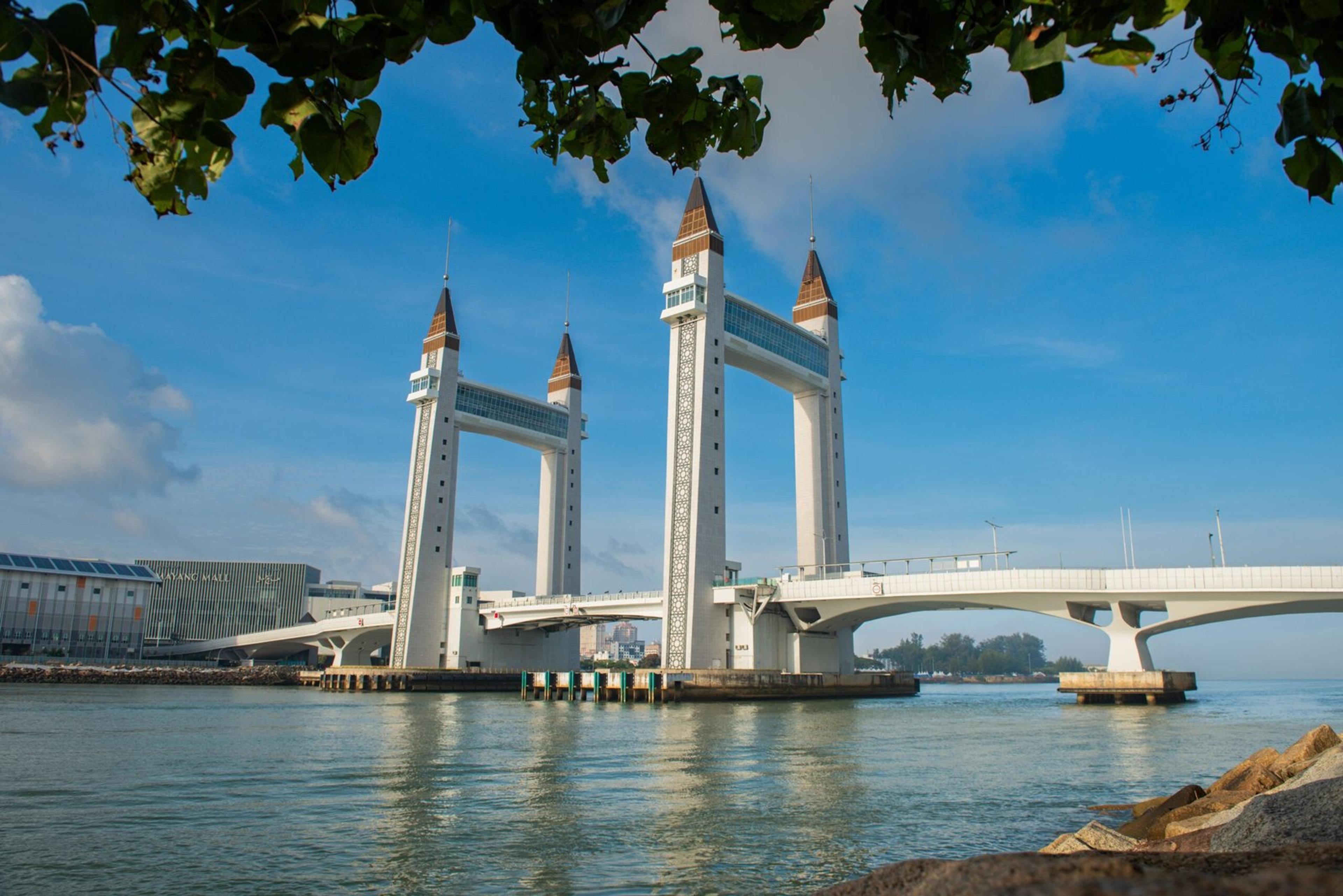 Capture of Terengganu's iconic drawbridge with clear blue skies and calm waters.